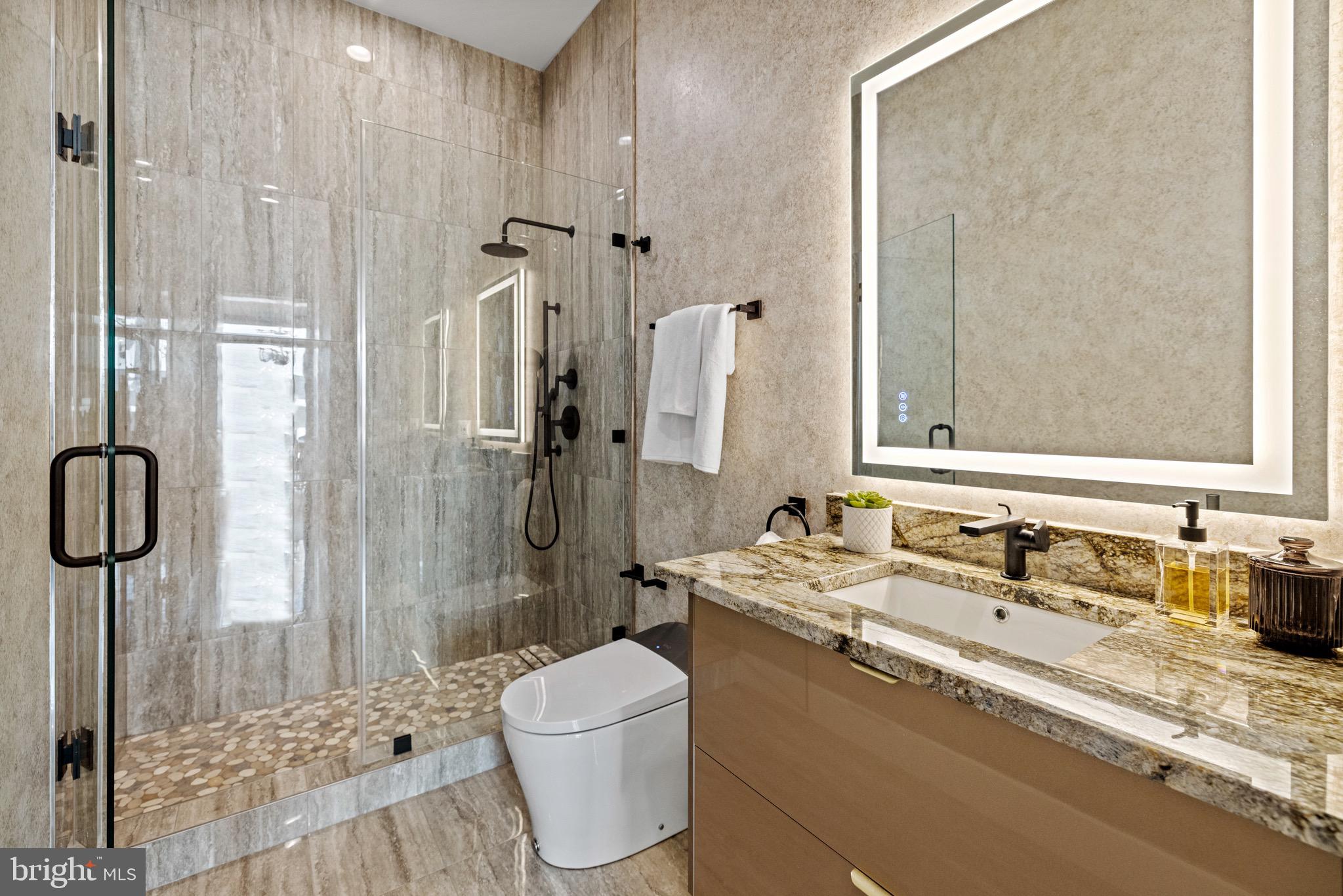 1573 Westmoreland Street McLean, VA 22101 - Photo 21 of 54 a bathroom with a sink toilet and shower