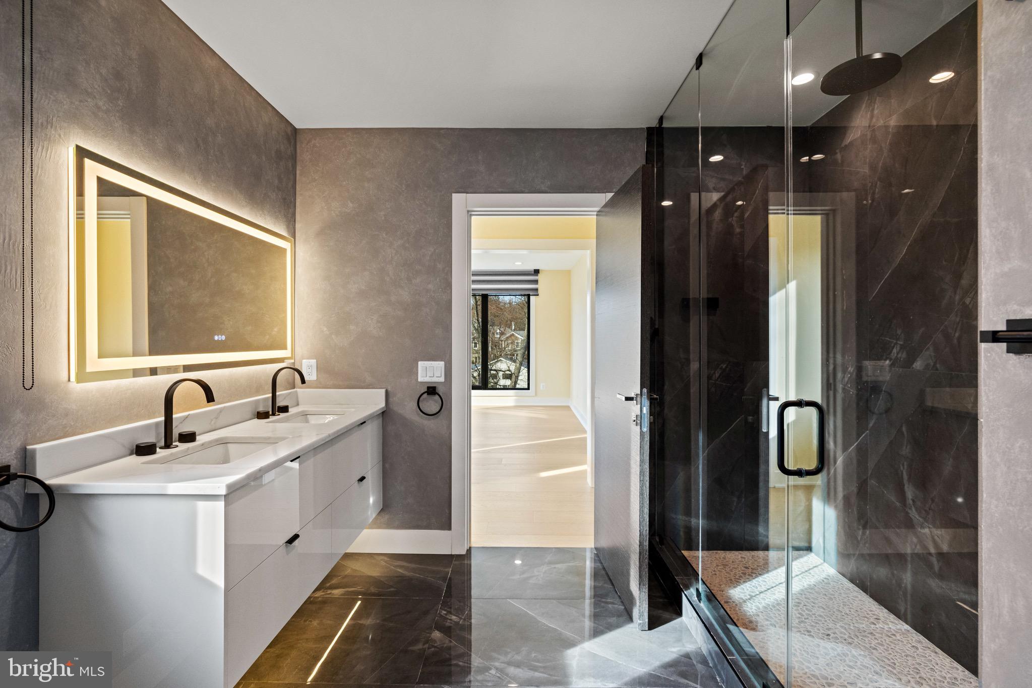 1573 Westmoreland Street McLean, VA 22101 - Photo 36 of 54 a en suite bathroom with a sink a mirror and shower