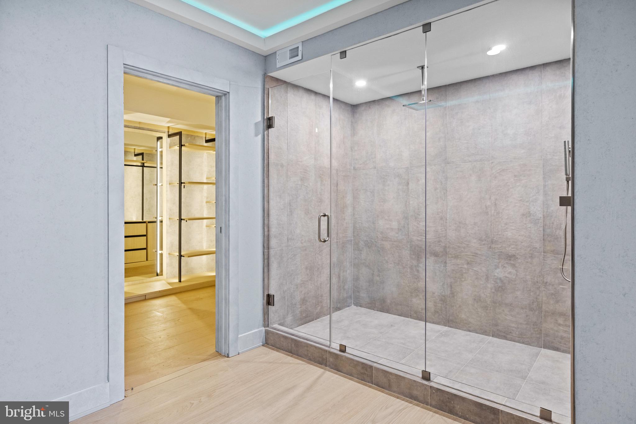 1573 Westmoreland Street McLean, VA 22101 - Photo 44 of 54 a bathroom with a glass shower door