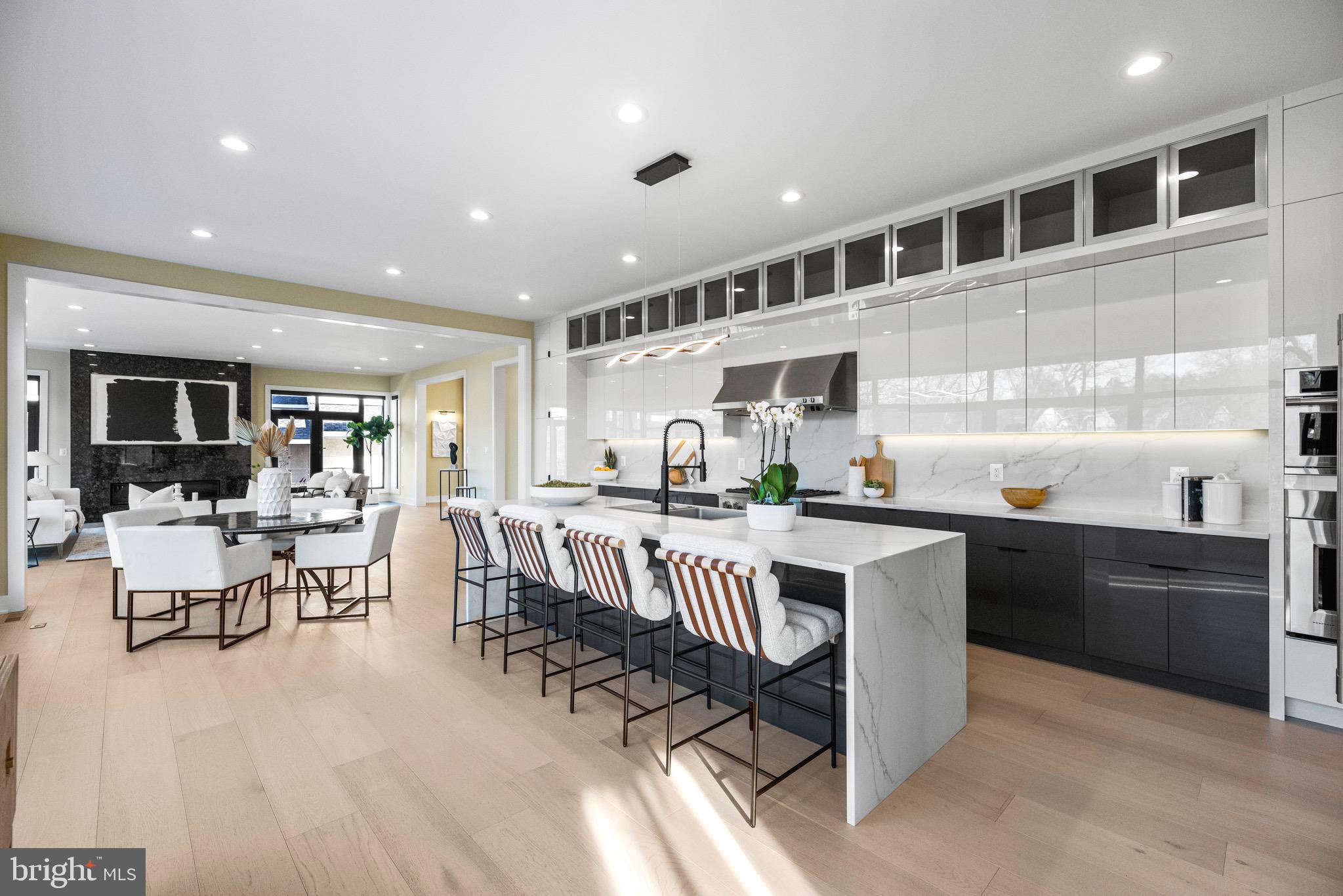 1573 Westmoreland Street McLean, VA 22101 - Photo 7 of 54 a kitchen with stainless steel appliances granite countertop sink stove top oven and cabinets
