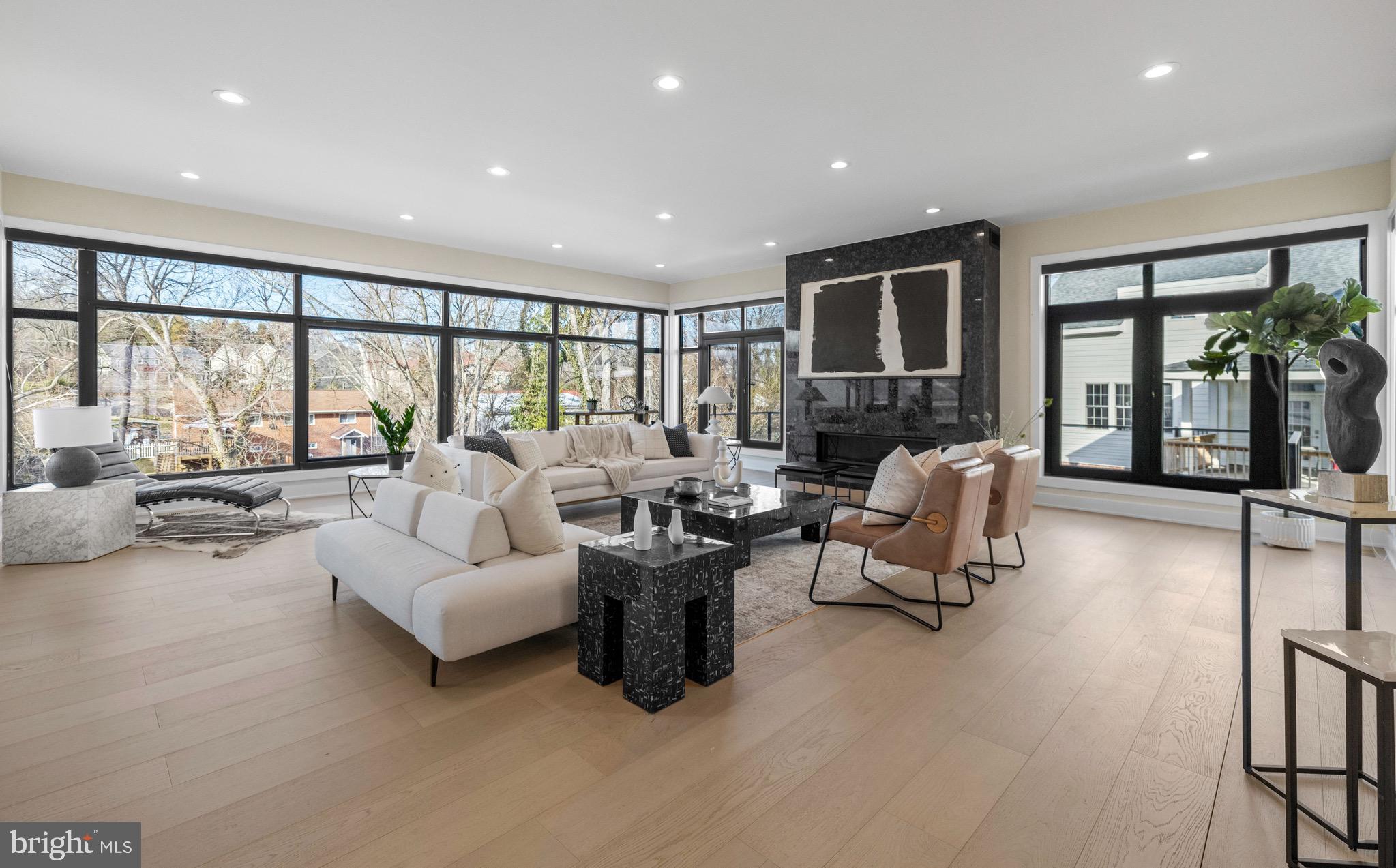 1573 Westmoreland Street McLean, VA 22101 - Photo 8 of 54 a living room with furniture large windows and a flat screen tv
