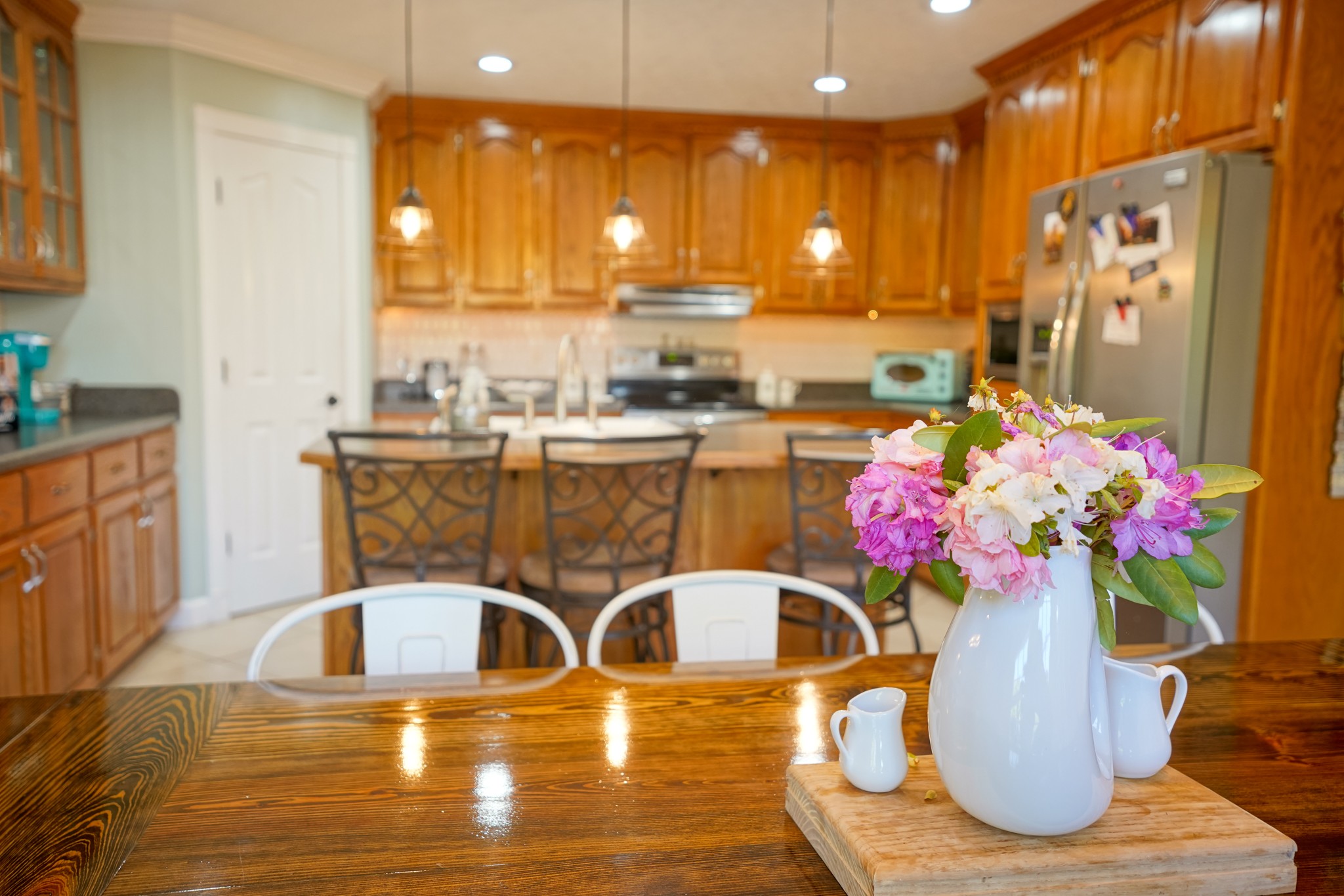 17 Marks Branch Road Leoma, TN 38468 - Photo 23 of 50 a kitchen with a table potted plant and refrigerator