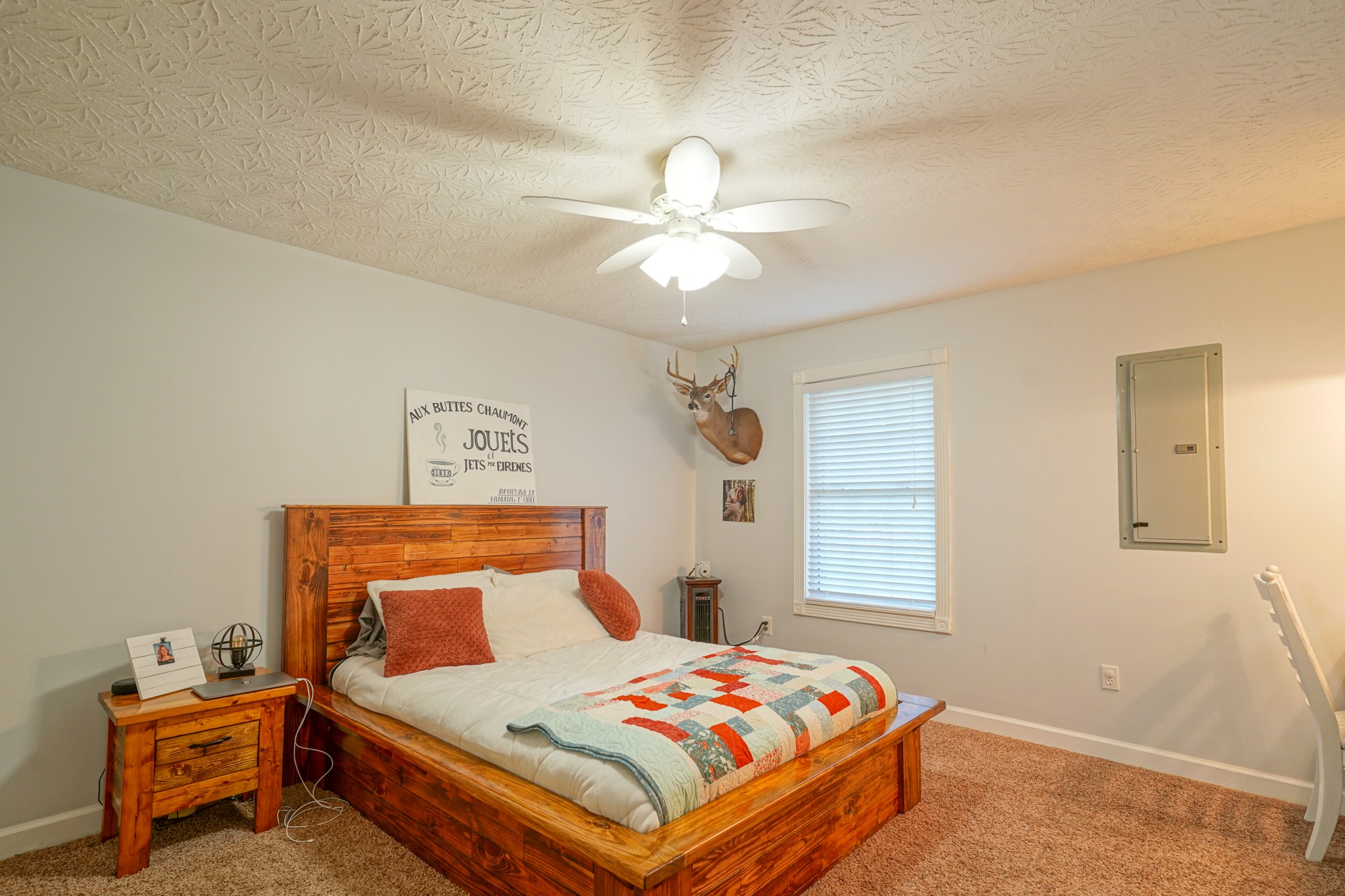 17 Marks Branch Road Leoma, TN 38468 - Photo 36 of 50 a bedroom with a bed and a chandelier