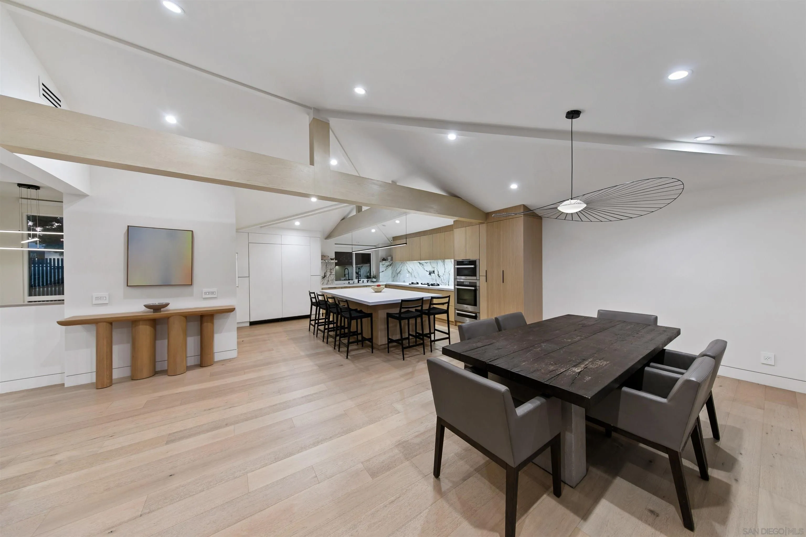5675 Soledad Mountain Road La Jolla, CA 92037 - Photo 12 of 74 a view of a dining room with furniture and wooden floor