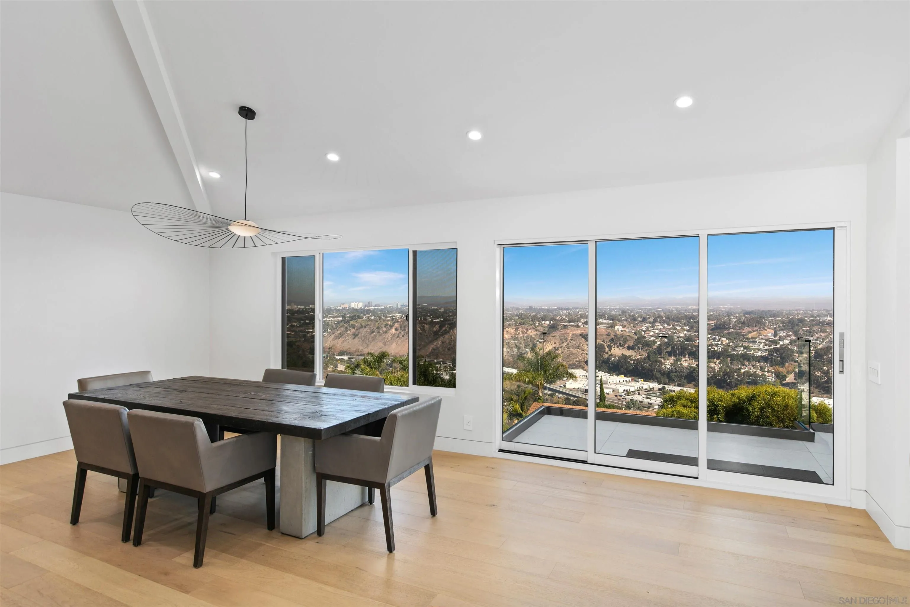 5675 Soledad Mountain Road La Jolla, CA 92037 - Photo 18 of 74 a view of a dining room with furniture window and outside view