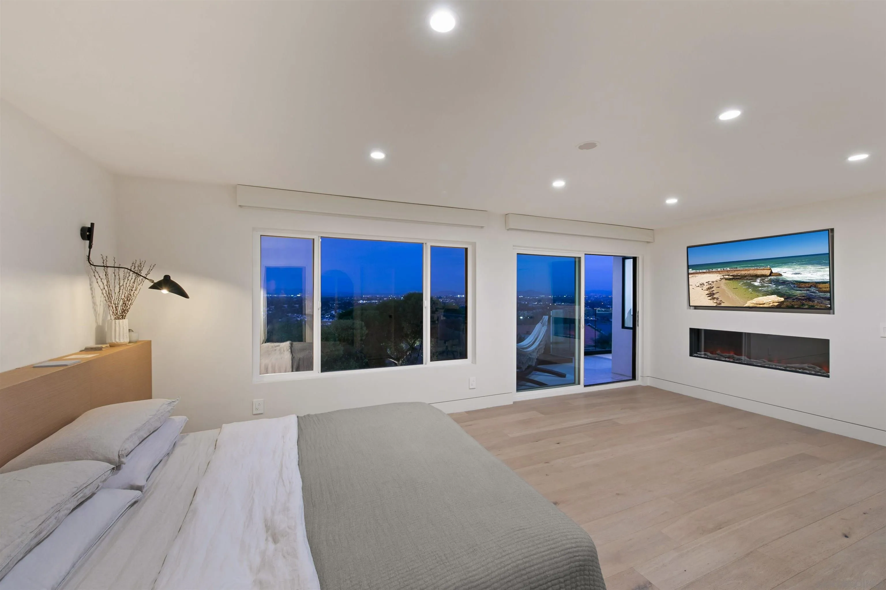 5675 Soledad Mountain Road La Jolla, CA 92037 - Photo 21 of 74 a large bedroom with a large bed and a large window