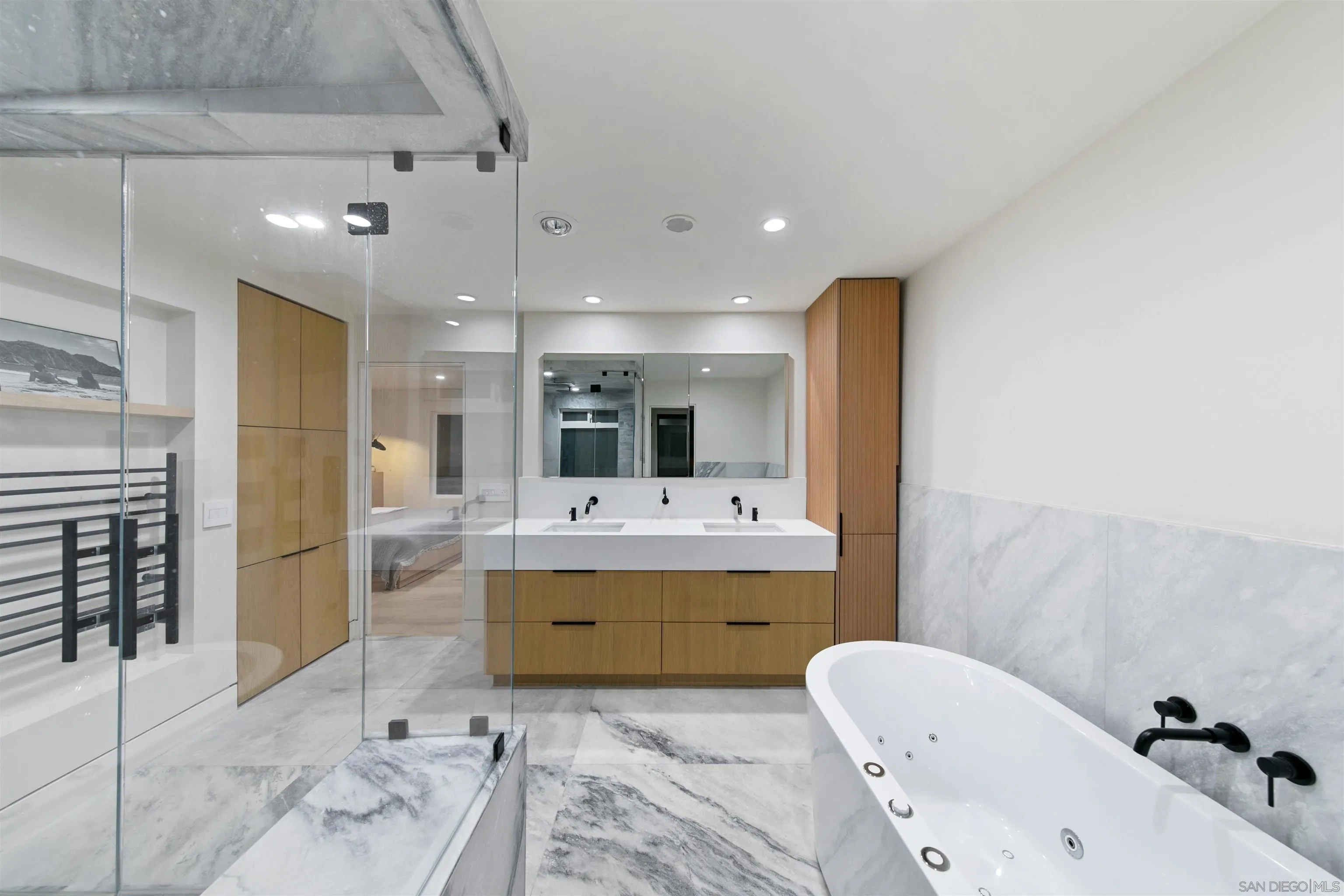5675 Soledad Mountain Road La Jolla, CA 92037 - Photo 26 of 74 a bathroom with a tub sink shower and mirror