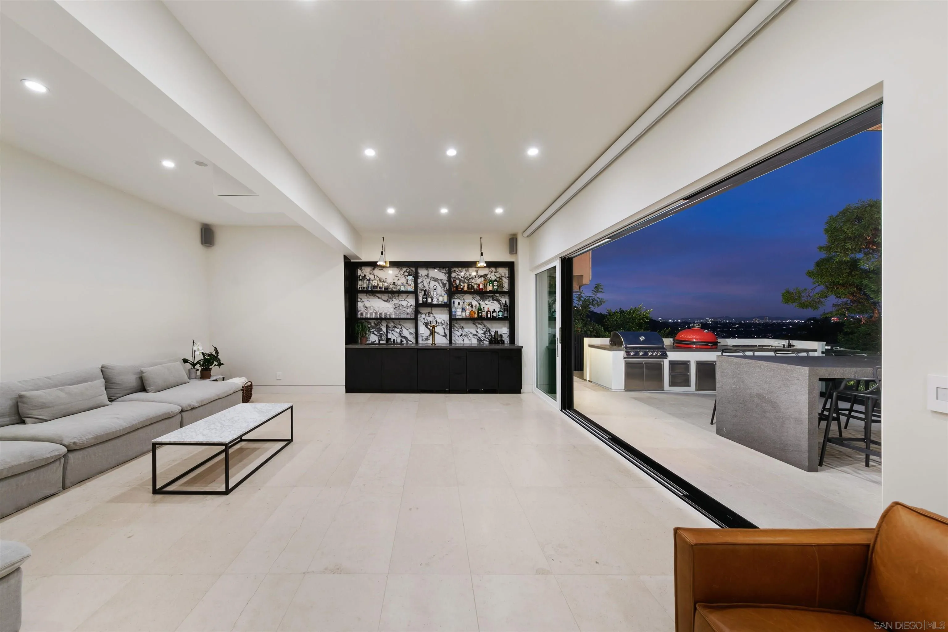5675 Soledad Mountain Road La Jolla, CA 92037 - Photo 33 of 74 a living room with furniture and a flat screen tv