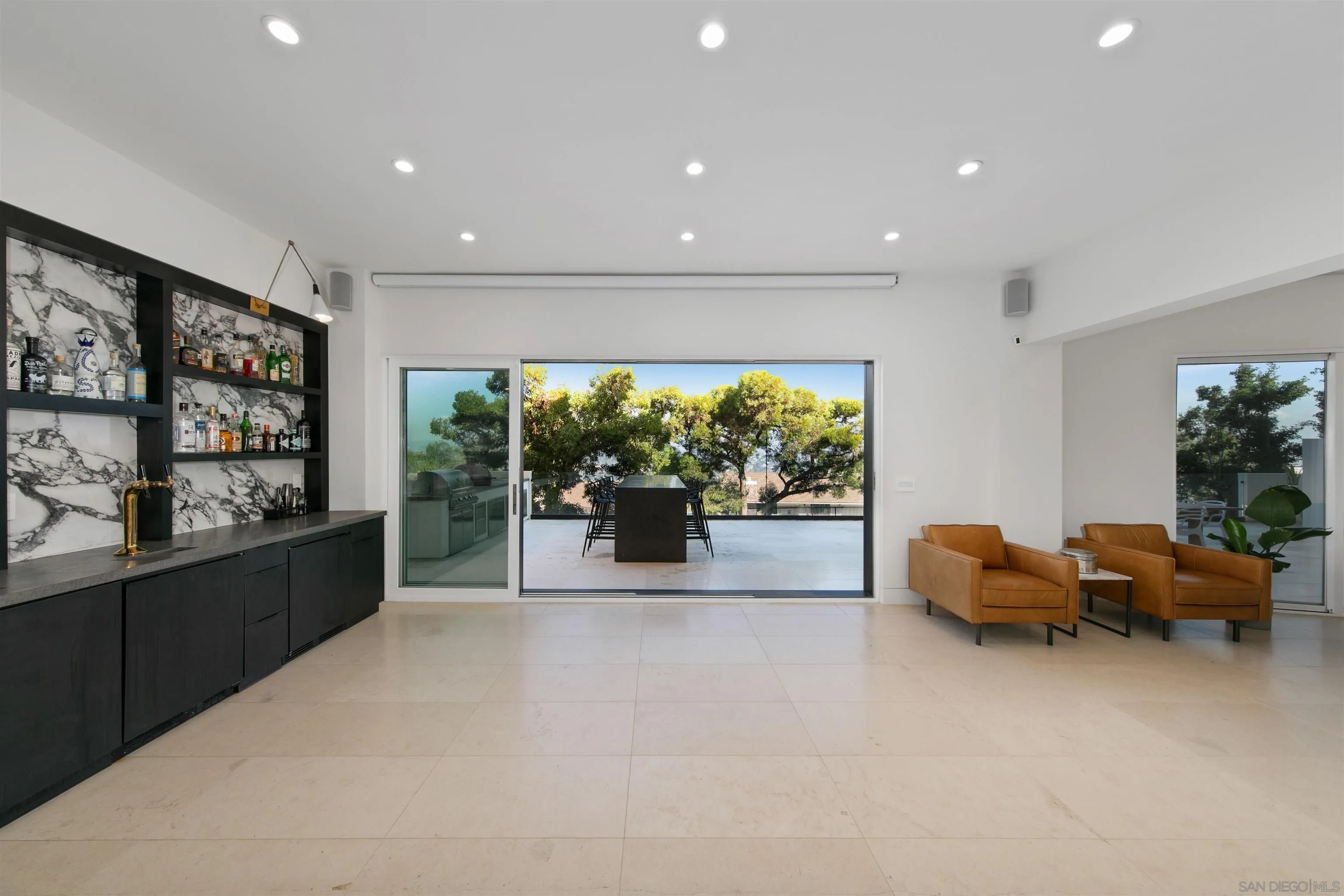 5675 Soledad Mountain Road La Jolla, CA 92037 - Photo 36 of 74 a kitchen with furniture and large windows