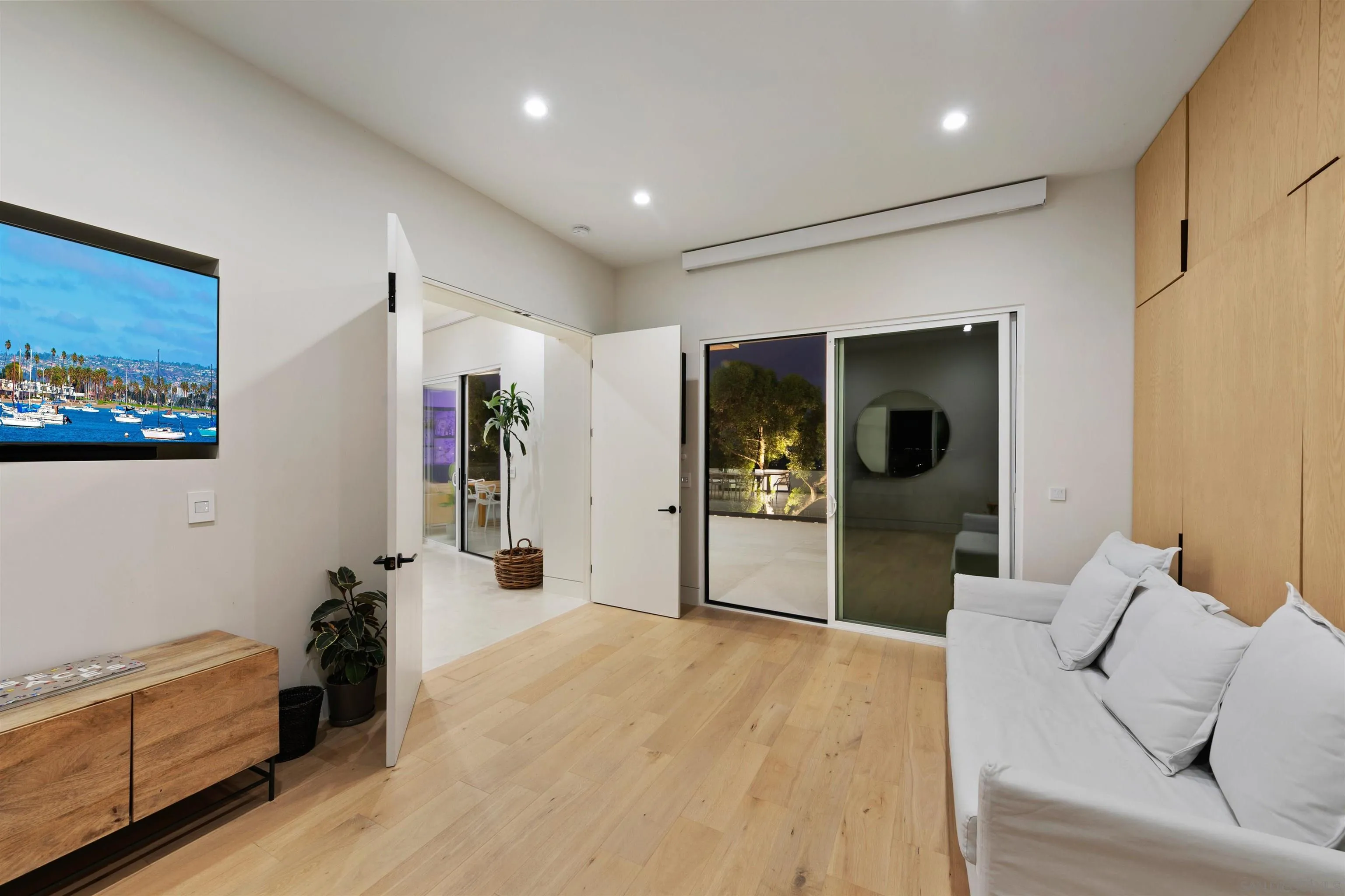 5675 Soledad Mountain Road La Jolla, CA 92037 - Photo 37 of 74 a living room with furniture and a flat screen tv