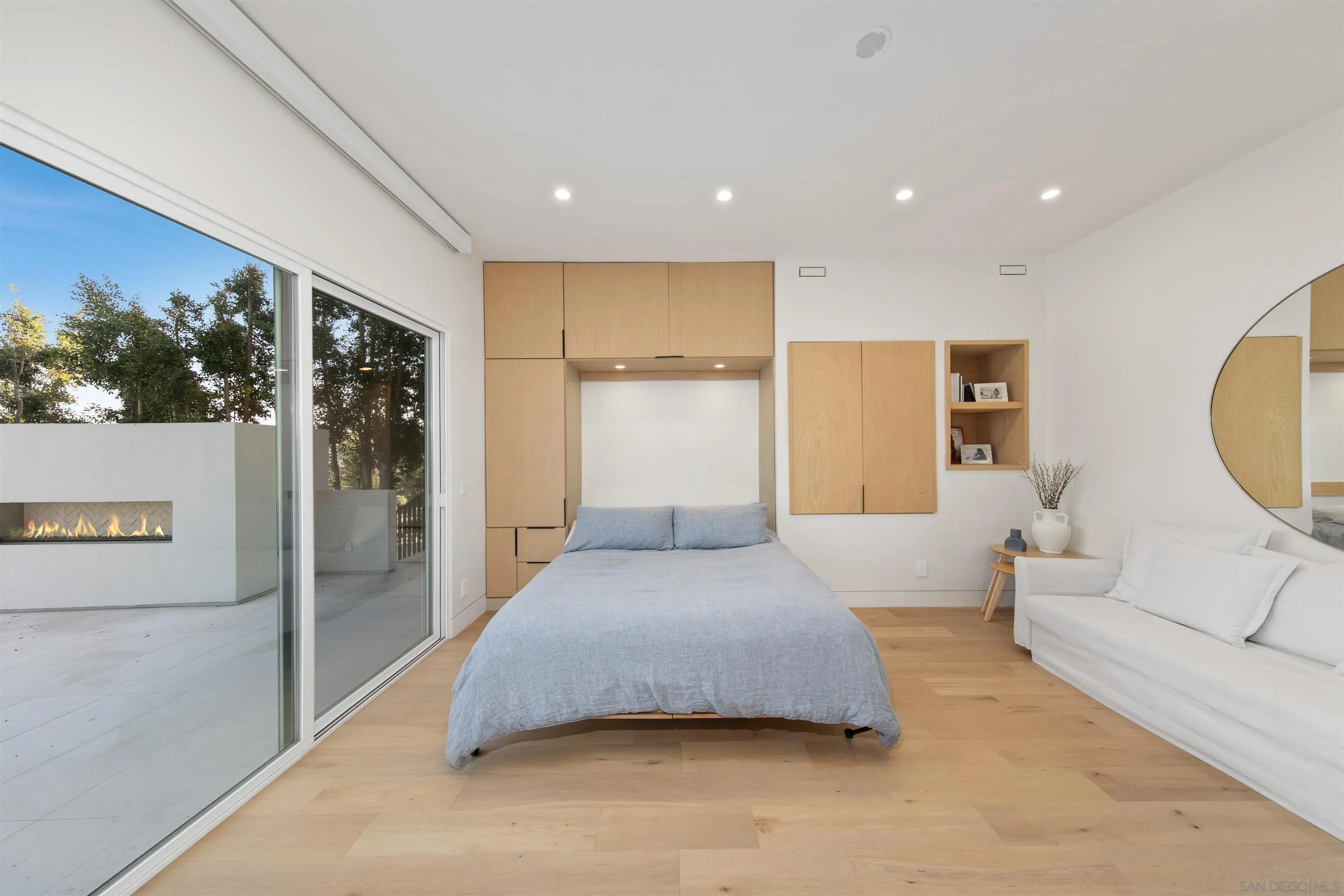 5675 Soledad Mountain Road La Jolla, CA 92037 - Photo 39 of 74 a spacious bedroom with a large bed and a large window