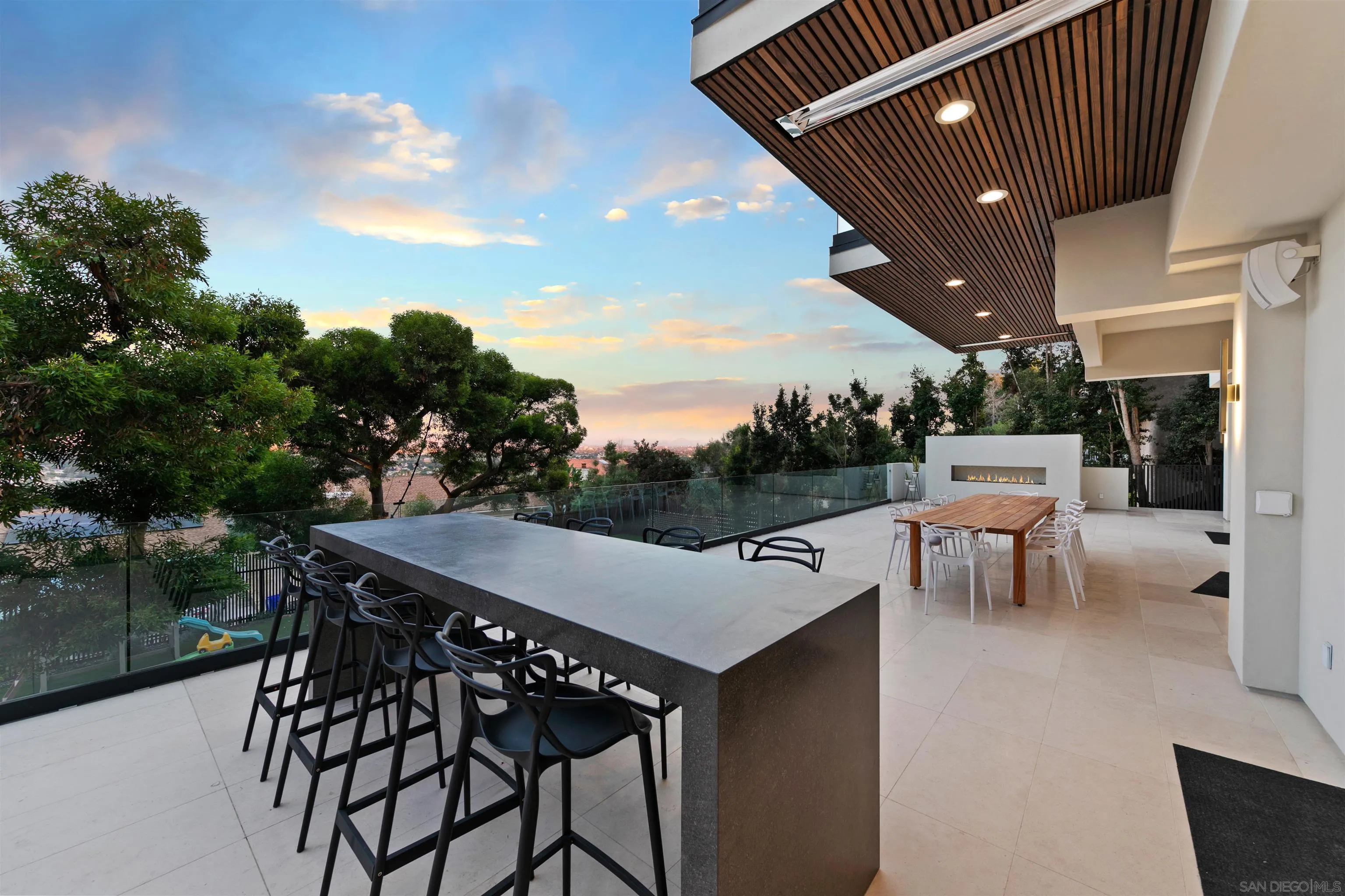 5675 Soledad Mountain Road La Jolla, CA 92037 - Photo 44 of 74 a patio with table and chairs