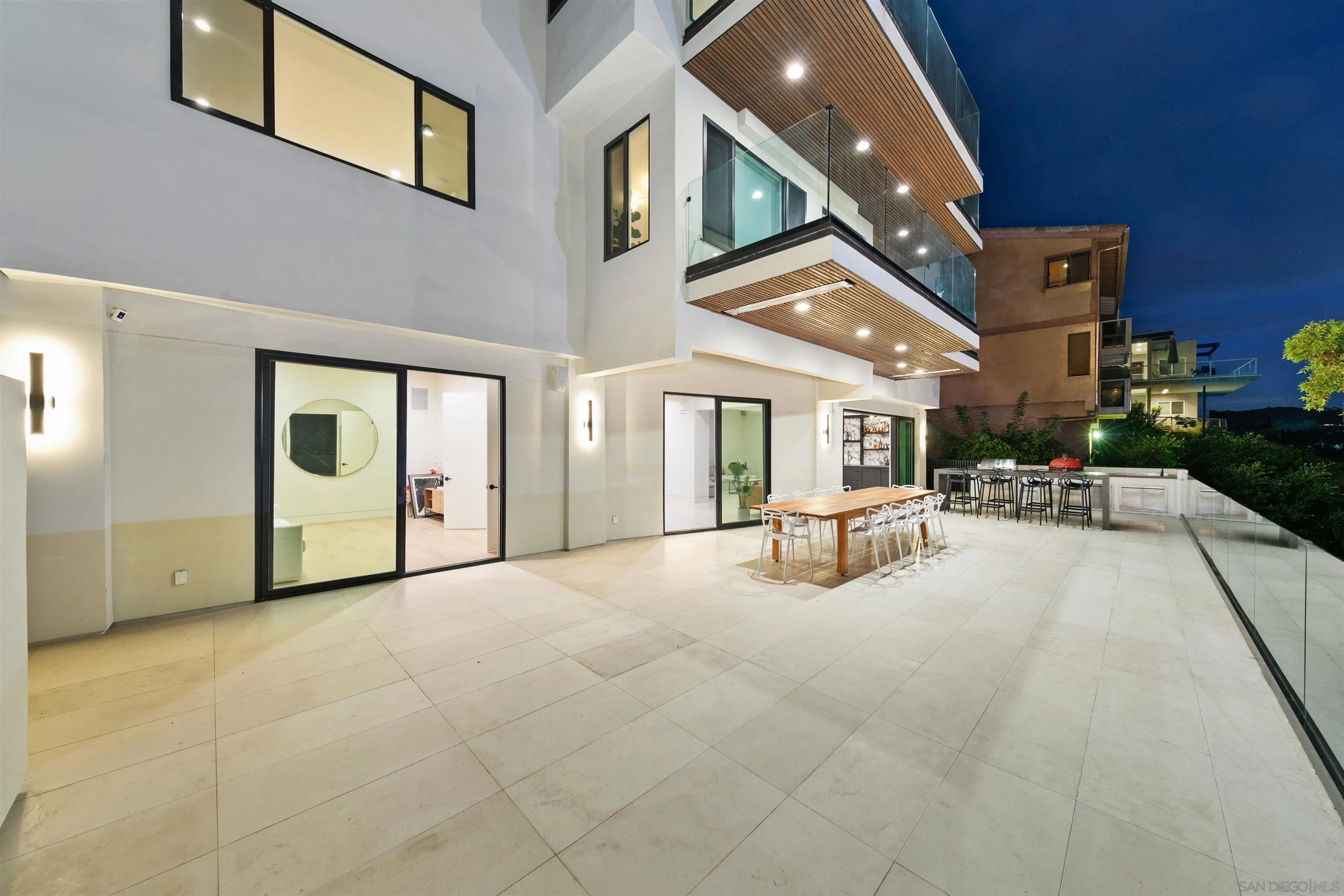 5675 Soledad Mountain Road La Jolla, CA 92037 - Photo 51 of 74 a very nice looking house with a large window and chandelier in front of it