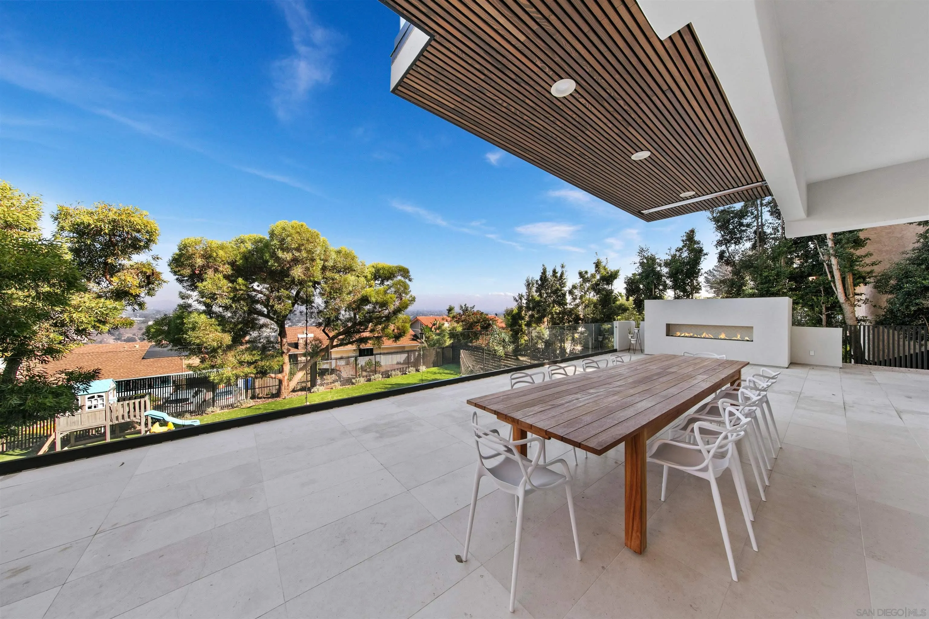 5675 Soledad Mountain Road La Jolla, CA 92037 - Photo 52 of 74 a table and chairs in front of a house
