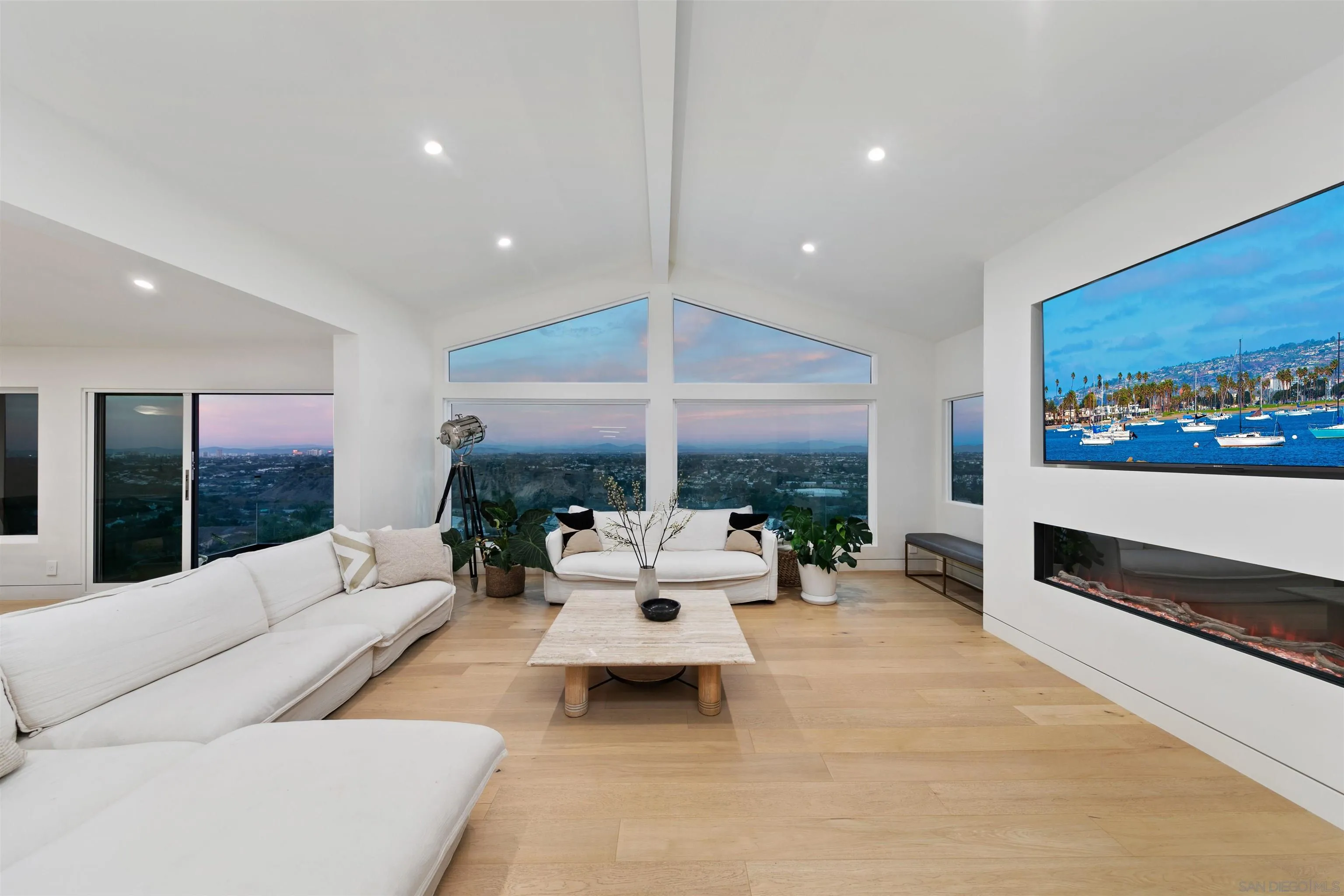 5675 Soledad Mountain Road La Jolla, CA 92037 - Photo 6 of 74 a living room with furniture large window and a flat screen tv