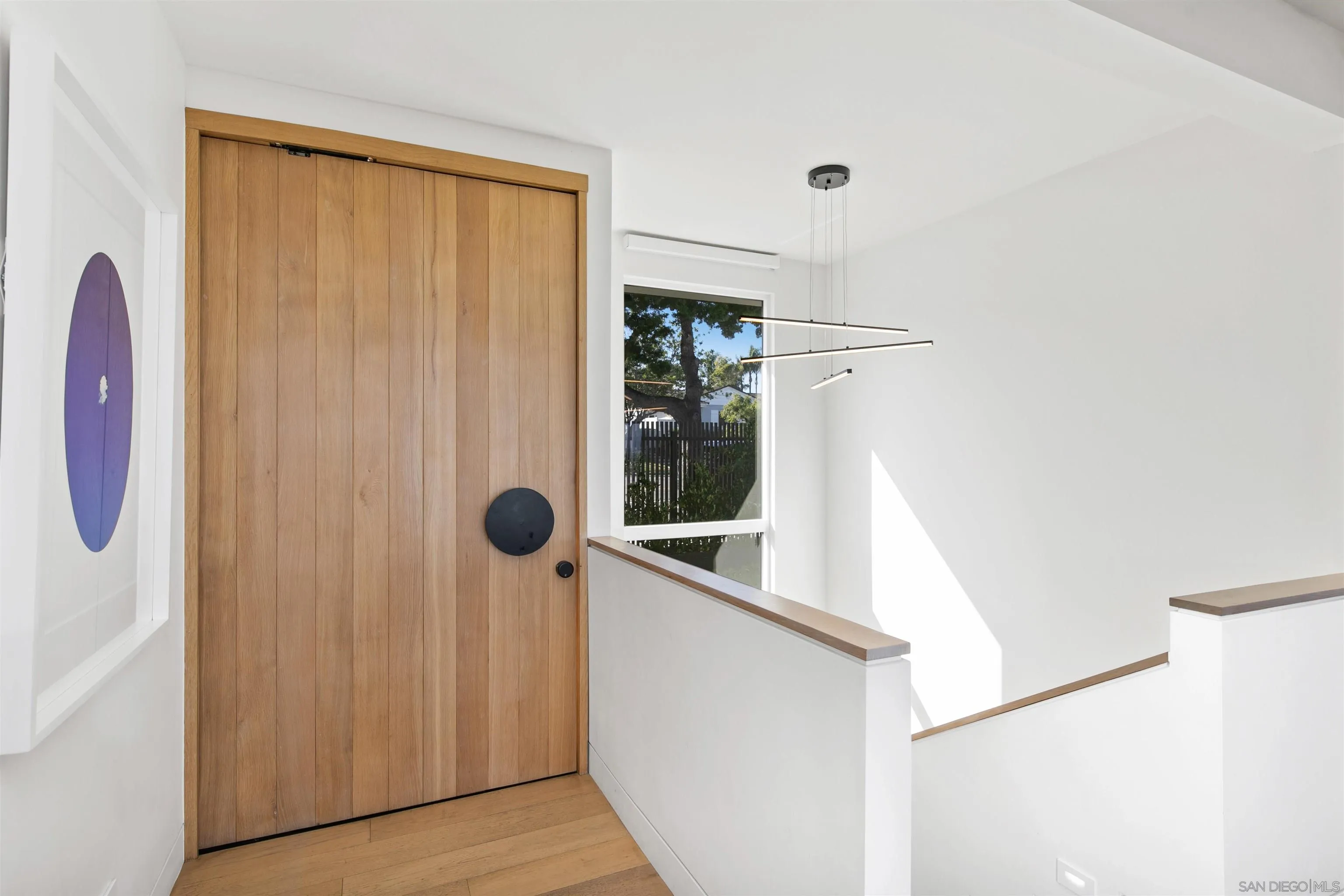 5675 Soledad Mountain Road La Jolla, CA 92037 - Photo 68 of 74 a view of a hallway with closet and a window