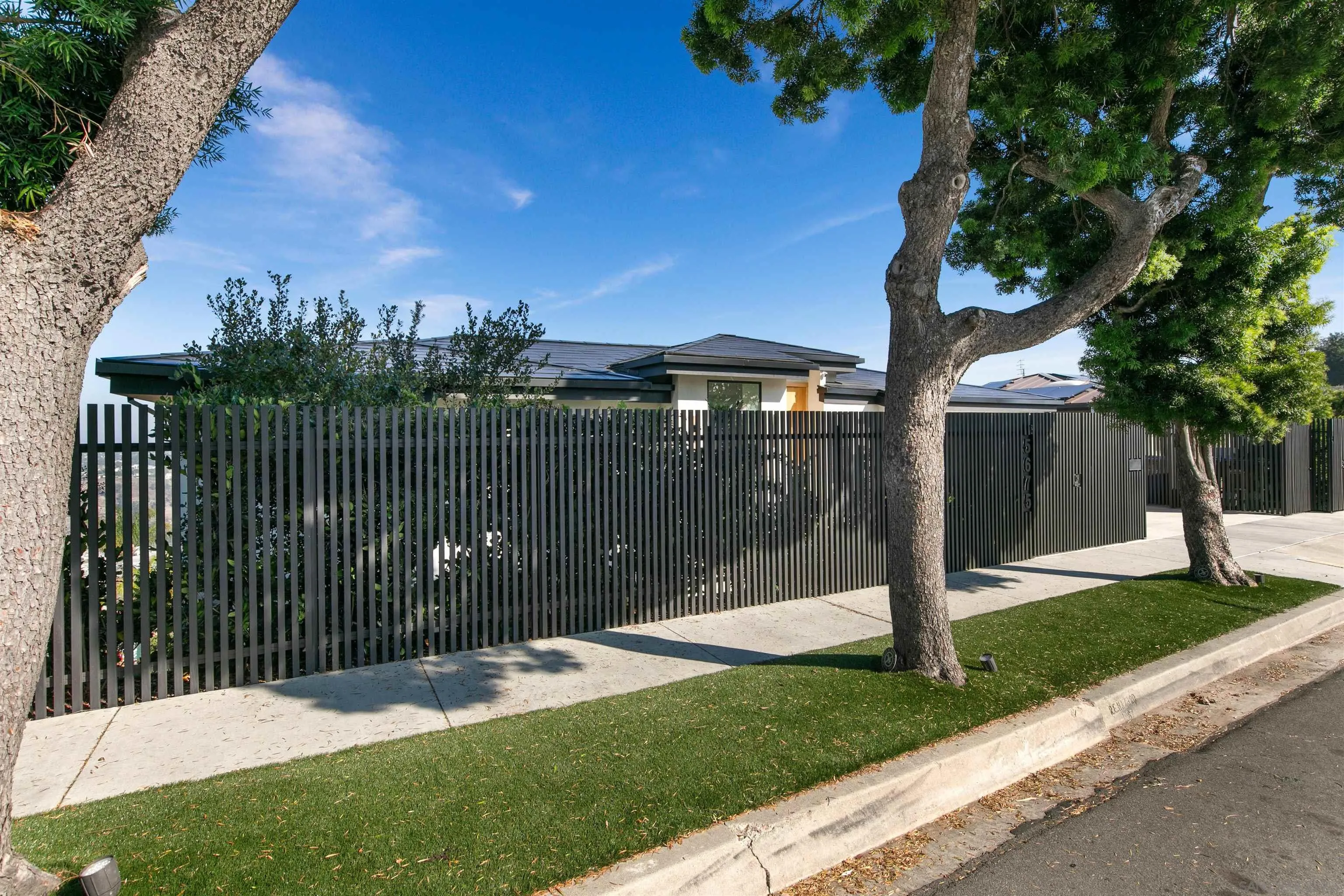 5675 Soledad Mountain Road La Jolla, CA 92037 - Photo 73 of 74 a front view of a house with a garden