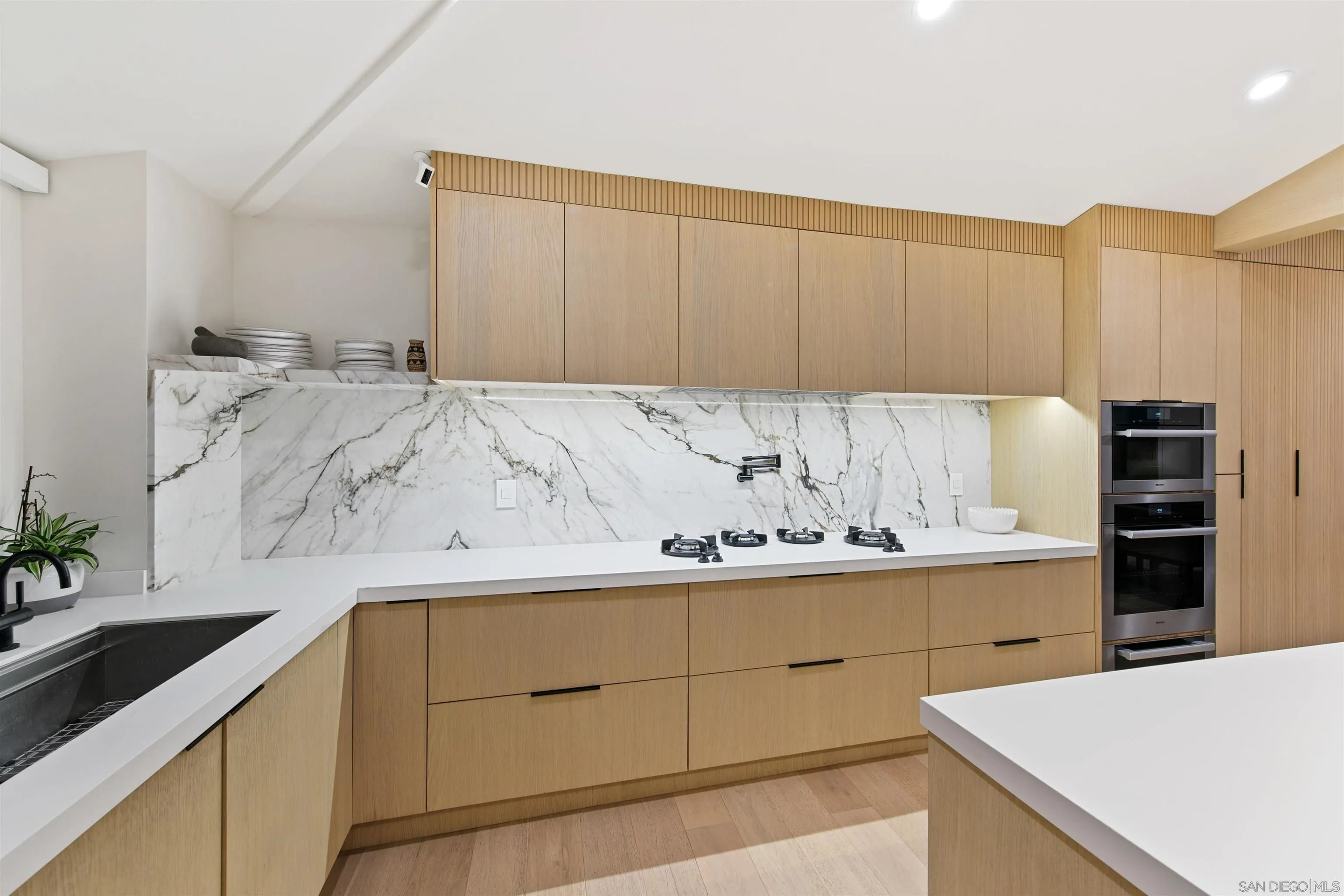 5675 Soledad Mountain Road La Jolla, CA 92037 - Photo 9 of 74 a kitchen with a sink and cabinets