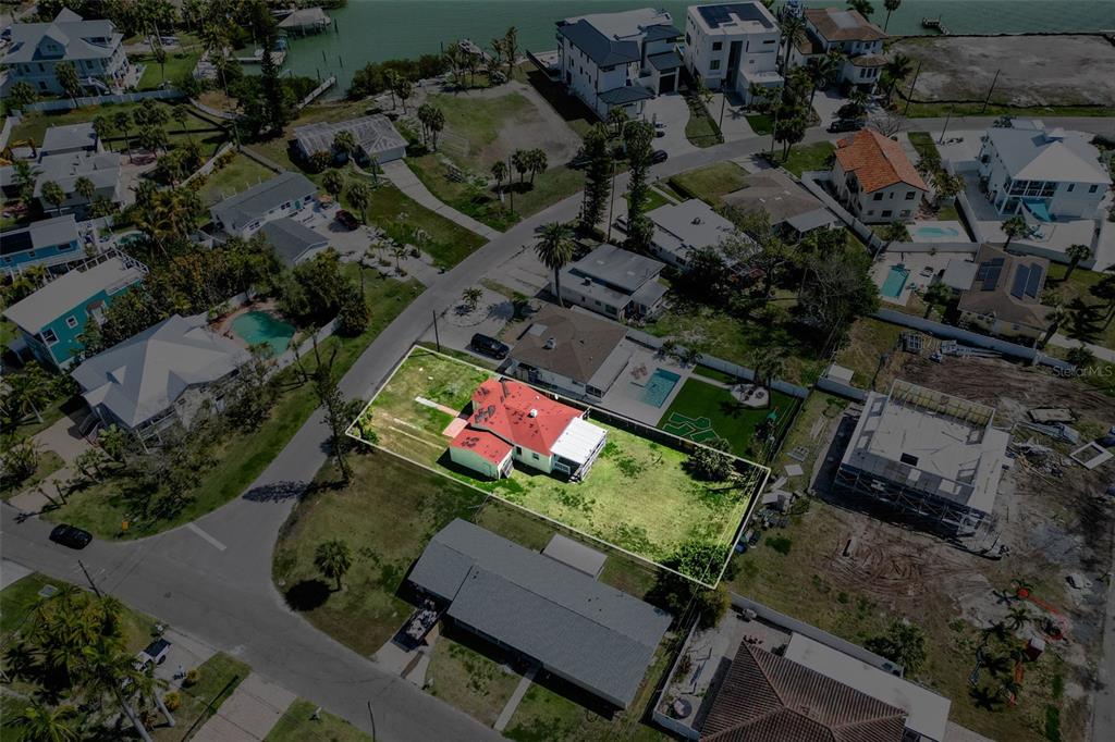 15822 Redington Drive Redington Beach, FL 33708 - Photo 3 of 11 an aerial view of a house with yard
