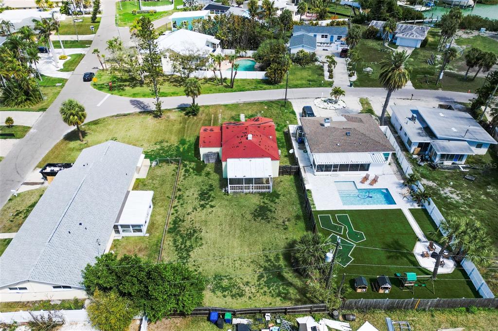 15822 Redington Drive Redington Beach, FL 33708 - Photo 8 of 11 an aerial view of residential houses with outdoor space and parking