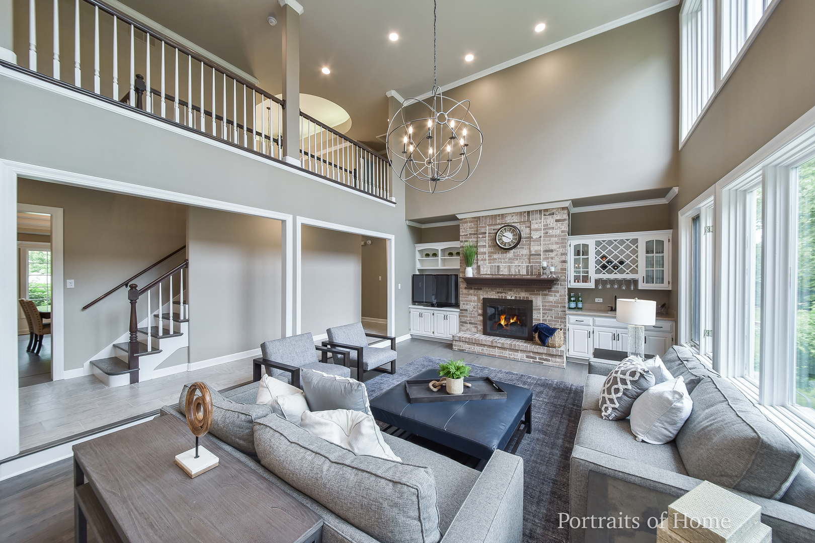 3721 Red Oak Lane Lisle, IL 60532 - Photo 11 of 35 a living room with furniture a fireplace and a chandelier