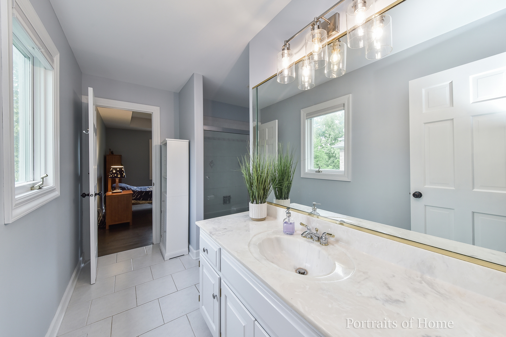 3721 Red Oak Lane Lisle, IL 60532 - Photo 22 of 35 a en suite bathroom with a double vanity sink and a mirror