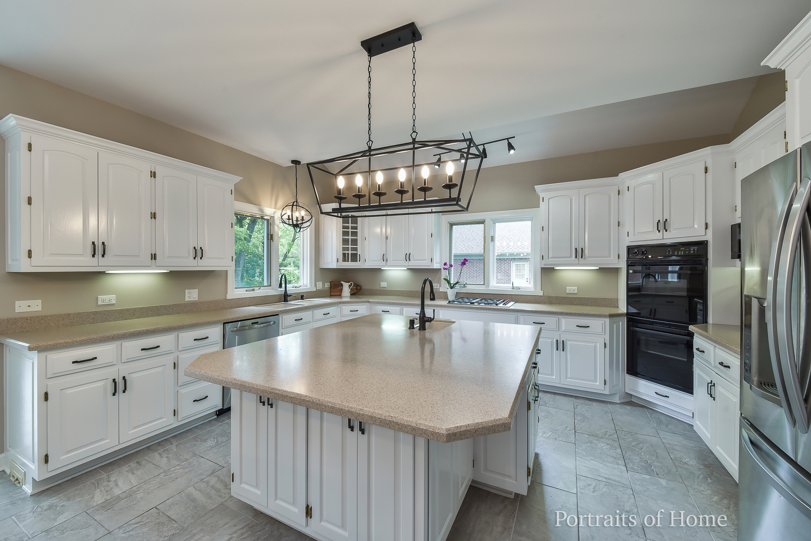 3721 Red Oak Lane Lisle, IL 60532 - Photo 6 of 35 a large kitchen with kitchen island granite countertop a sink a center island stainless steel appliances and cabinets