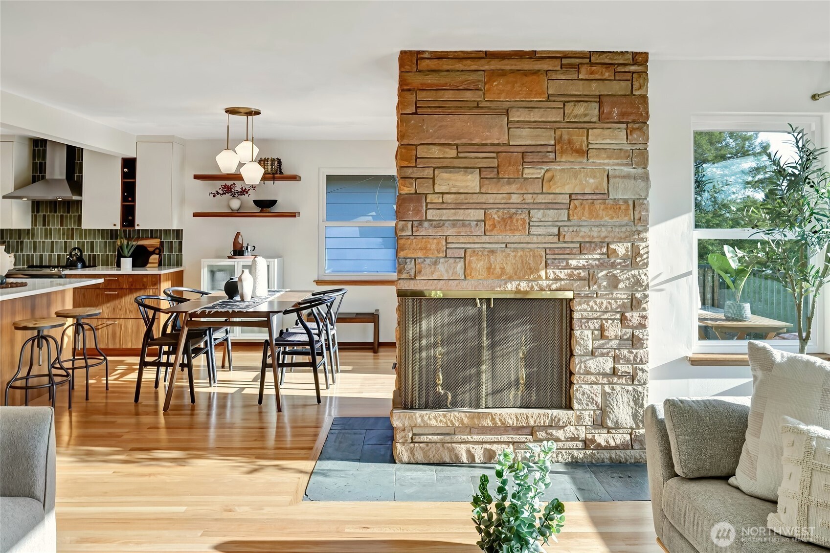 7571 45th Avenue Southwest Seattle, WA 98136 - Photo 8 of 40 a living room with fireplace furniture and a potted plant