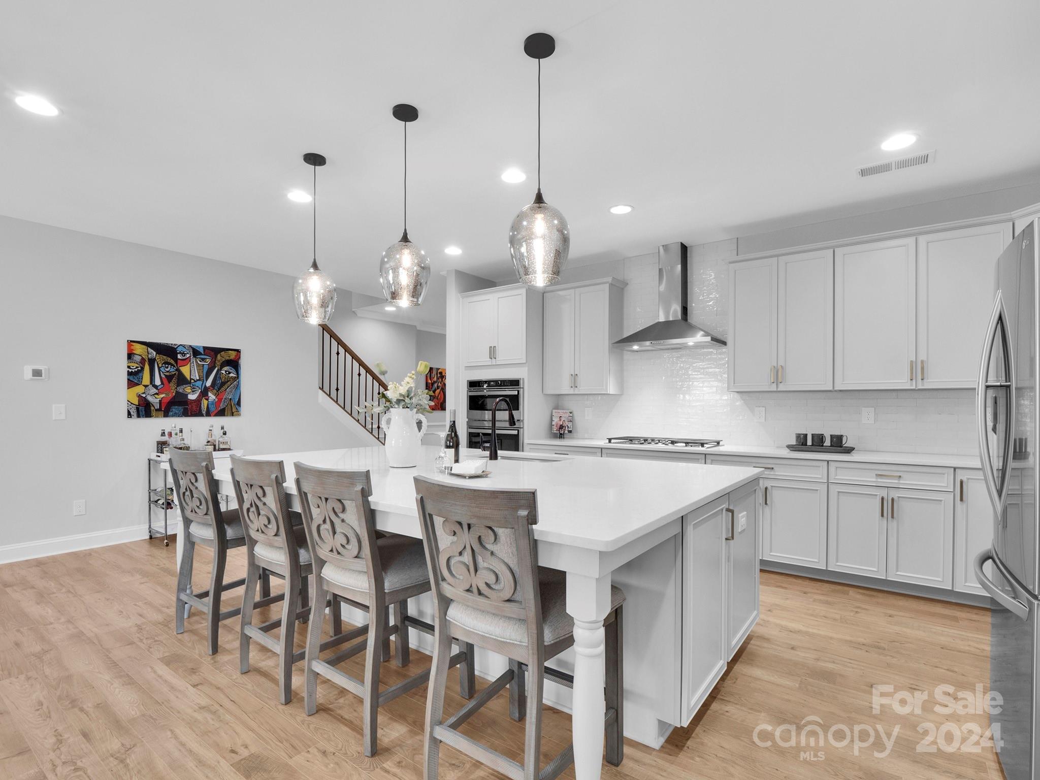 4011 Charlton Road Fort Mill, SC 29715 - Photo 14 of 48 a large white kitchen with lots of counter space and sink