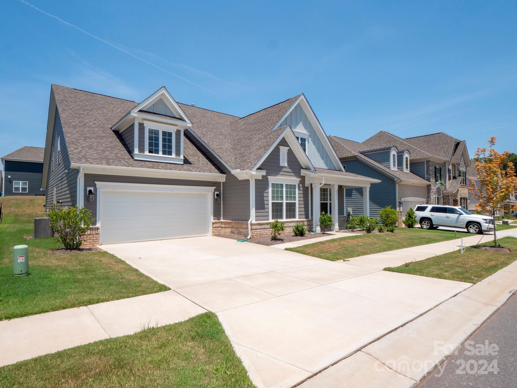 4011 Charlton Road Fort Mill, SC 29715 - Photo 2 of 48 a front view of a house with a yard