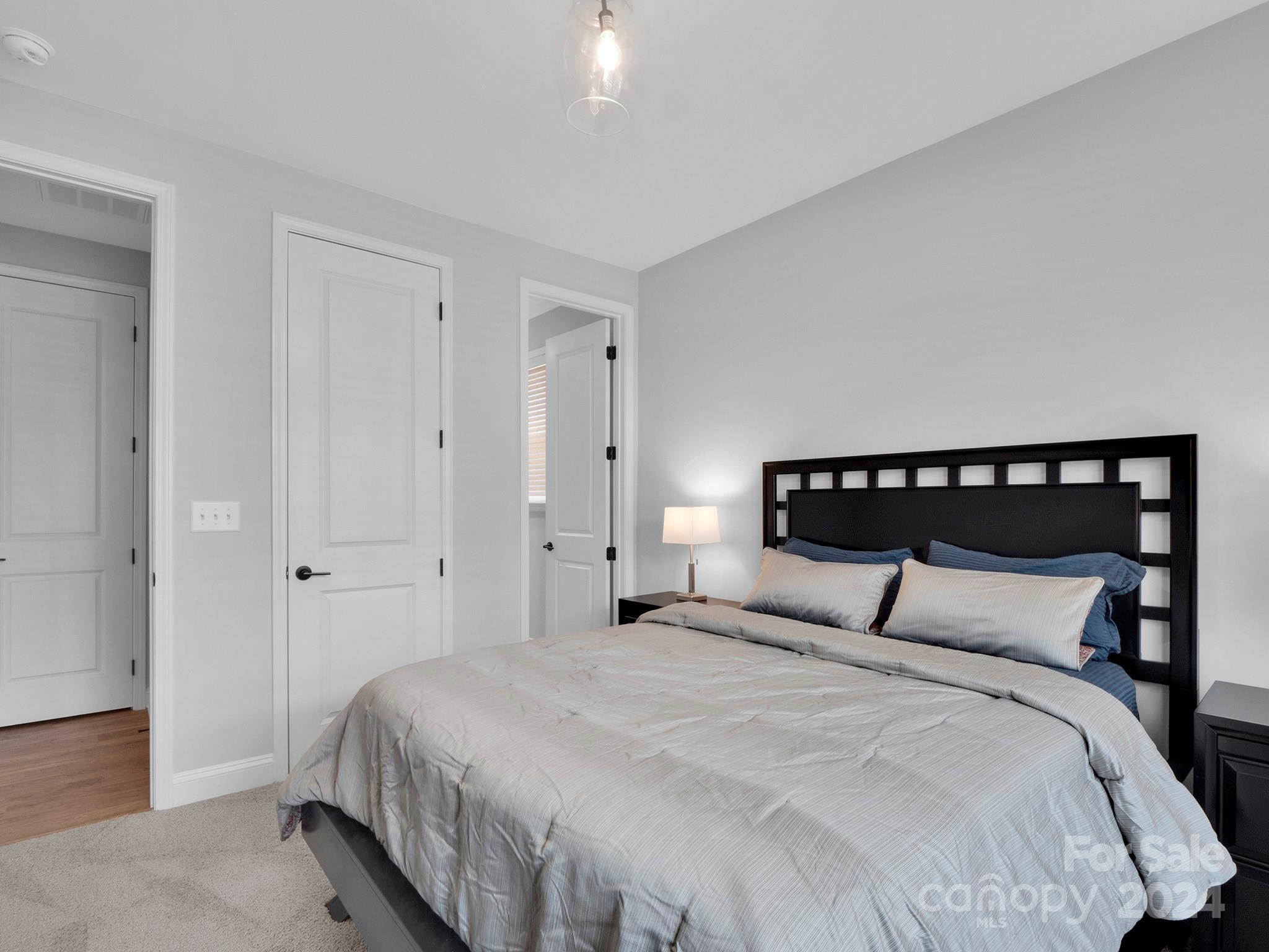 4011 Charlton Road Fort Mill, SC 29715 - Photo 21 of 48 a bedroom with a bed and wooden floor