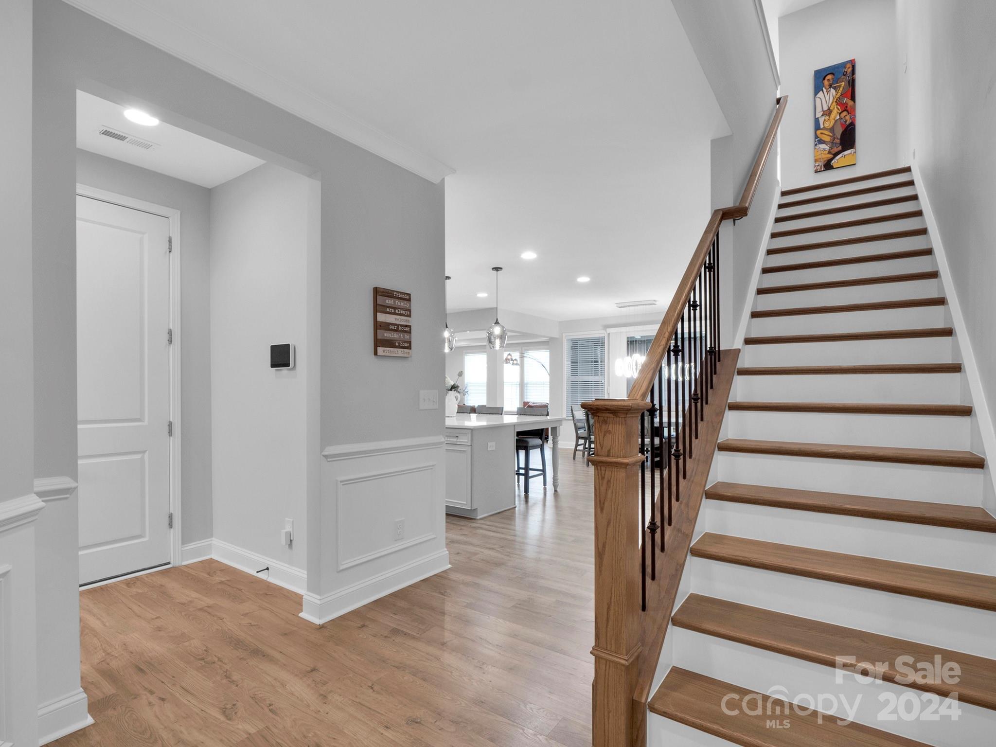 4011 Charlton Road Fort Mill, SC 29715 - Photo 24 of 48 a view of a hallway with wooden floor and stairs