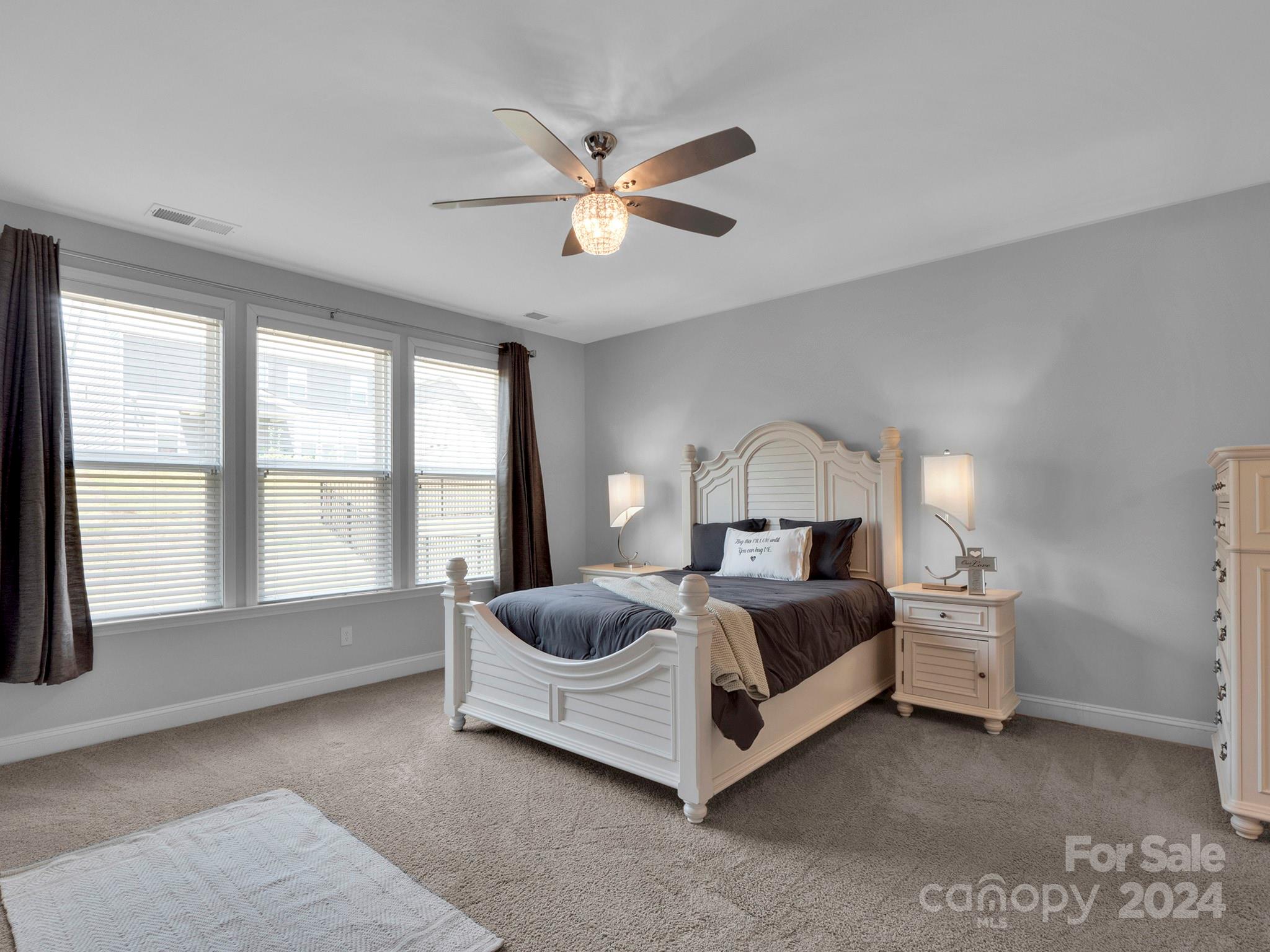 4011 Charlton Road Fort Mill, SC 29715 - Photo 29 of 48 a living room with a bed furniture and a large window