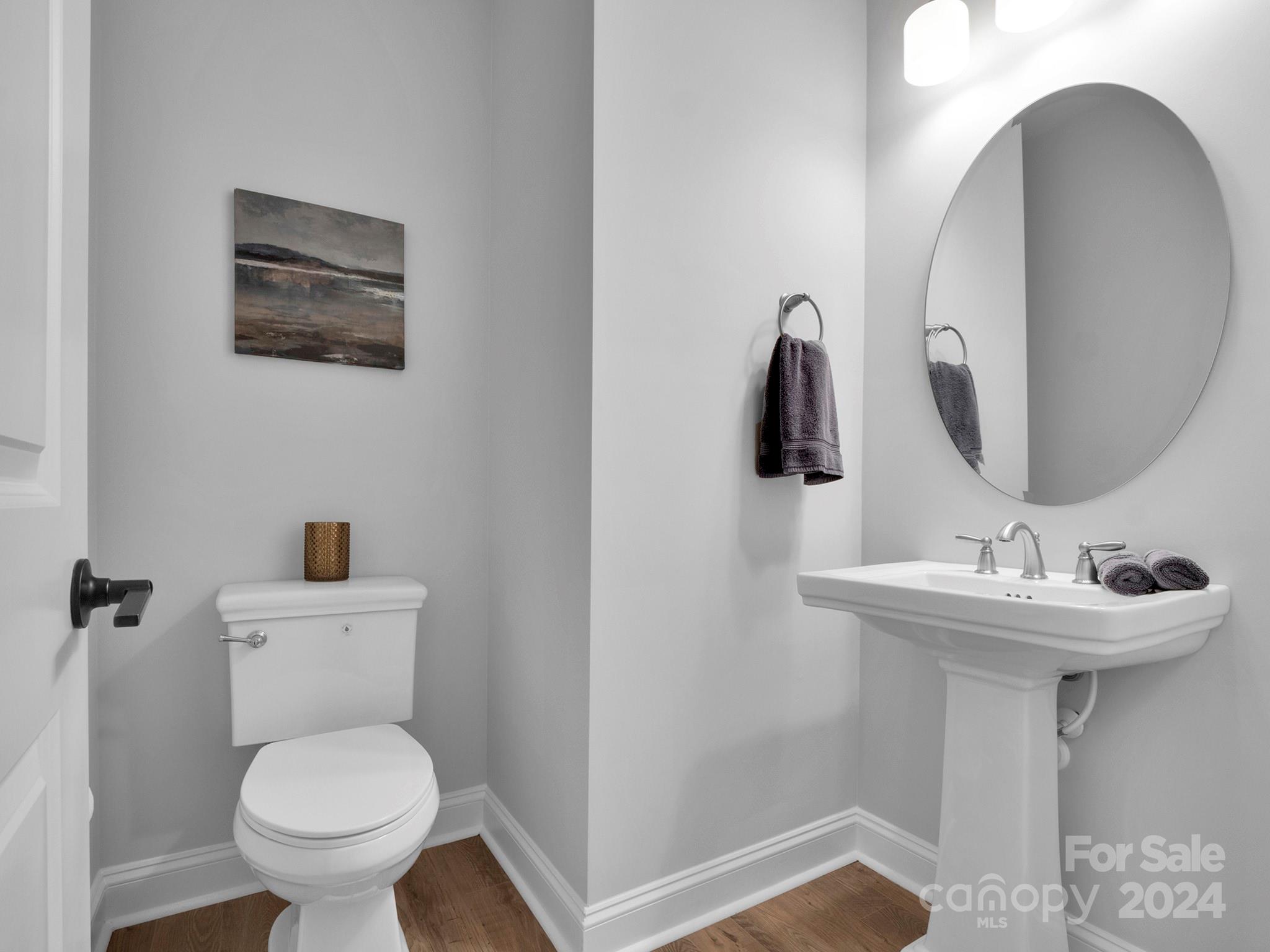 4011 Charlton Road Fort Mill, SC 29715 - Photo 44 of 48 a bathroom with a toilet sink and mirror