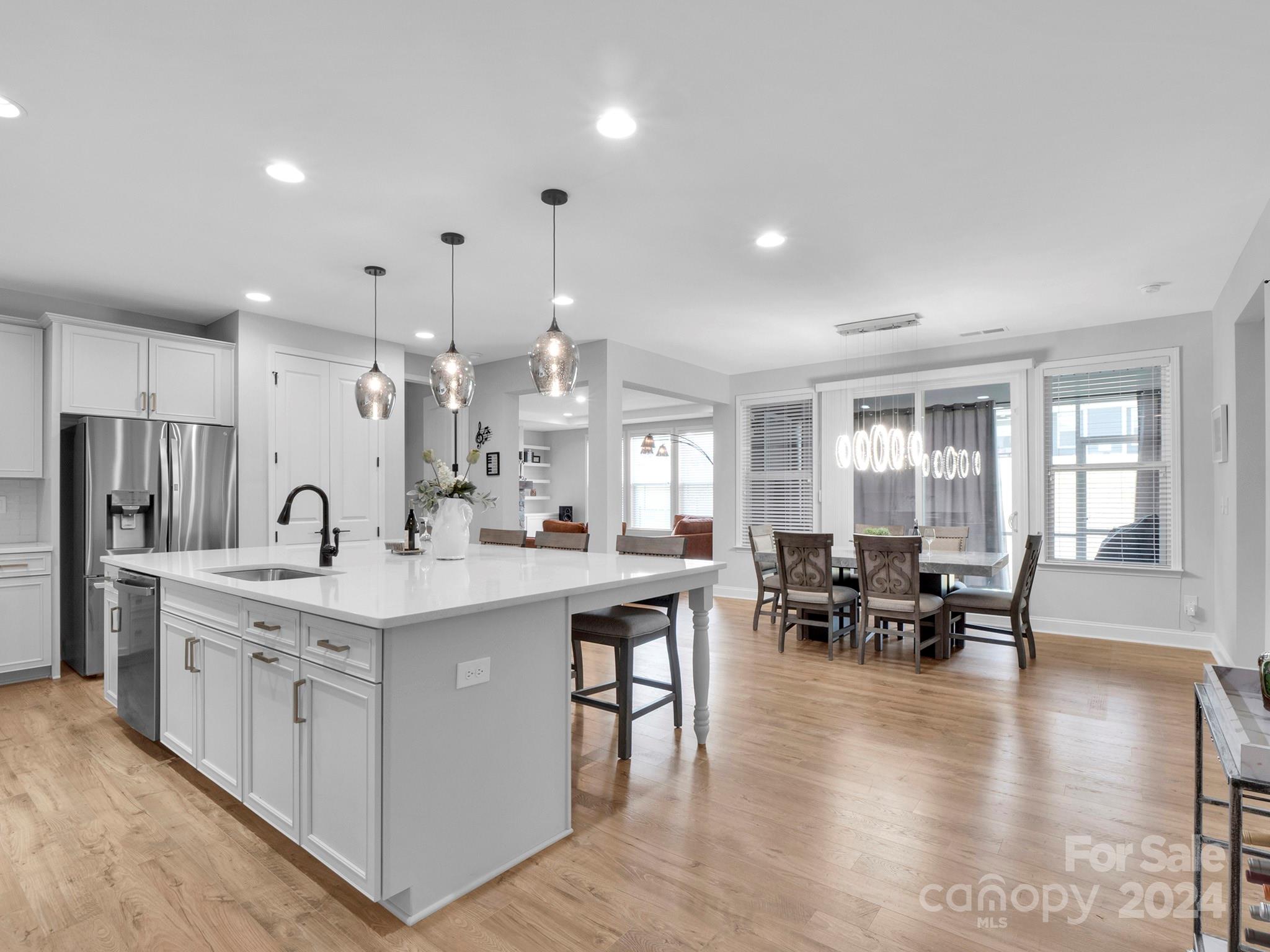 4011 Charlton Road Fort Mill, SC 29715 - Photo 7 of 48 a large white kitchen with lots of counter space and stainless steel appliances
