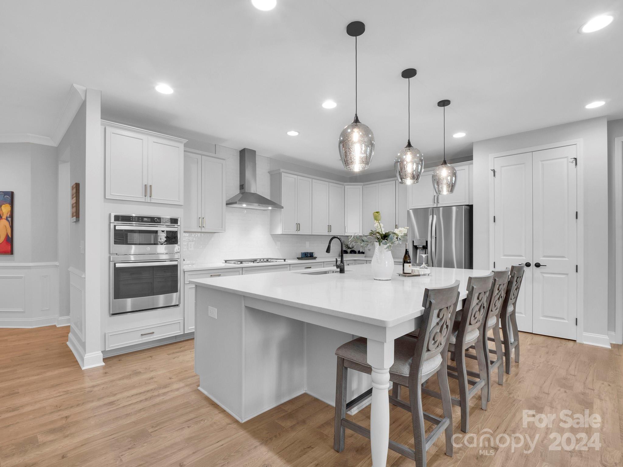 4011 Charlton Road Fort Mill, SC 29715 - Photo 8 of 48 a kitchen with kitchen island a dining table and chairs