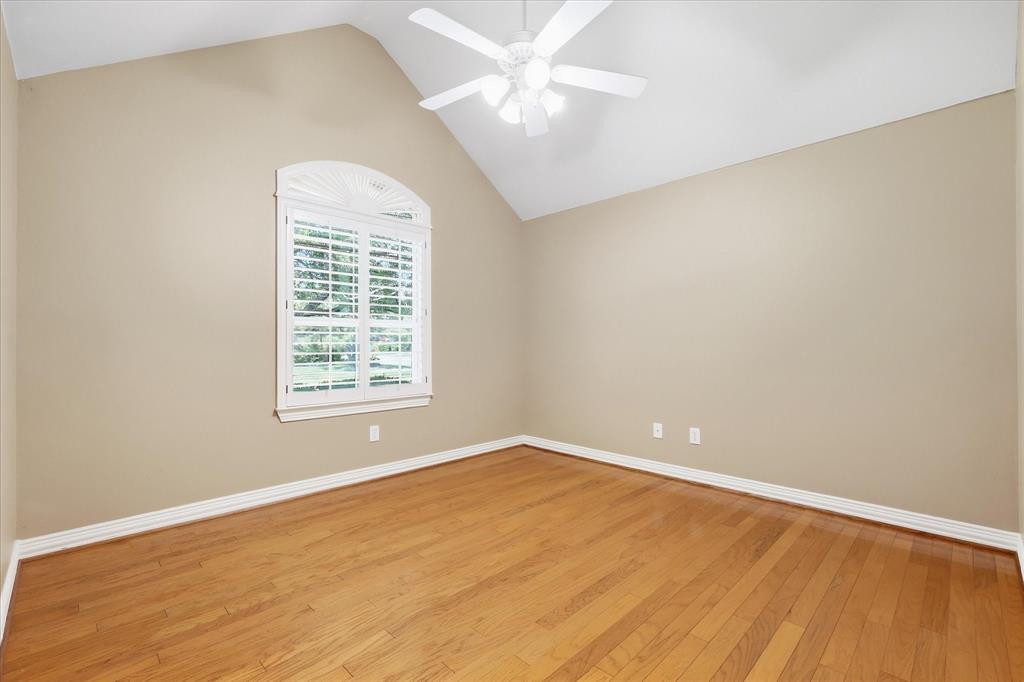 1447 Falls Road Coppell, TX 75019 - Photo 26 of 39 2nd Bedroom w-Wood Floors, Soaring Ceiling & Plantation Shutters