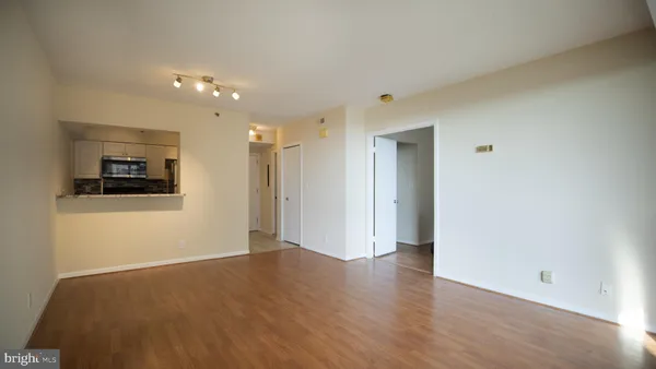 a view of a livingroom with wooden floor