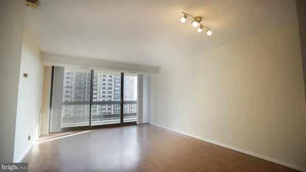 a view of an empty room with a window
