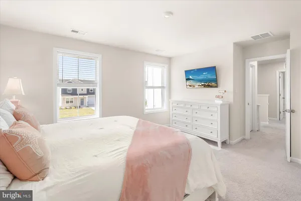 a bedroom with a bed and a view of bathroom