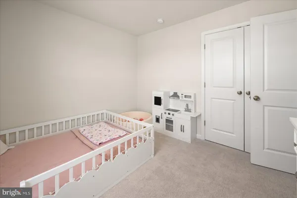 a view of room with window and cabinet