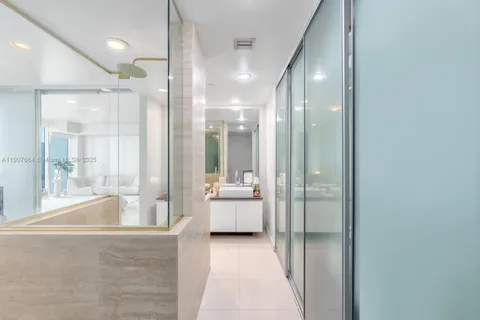 a bathroom with a tub shower and sink