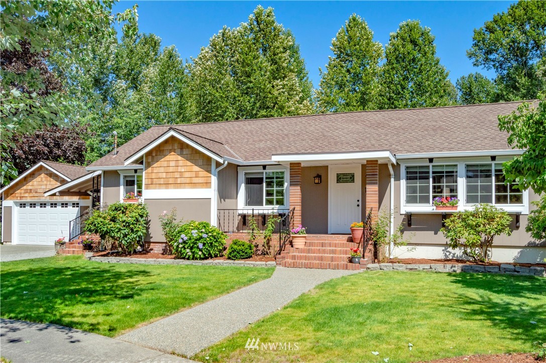 1601 237th Place Southwest Bothell, WA 98021 - Photo 1 of 1 a view of a house with a yard and plants