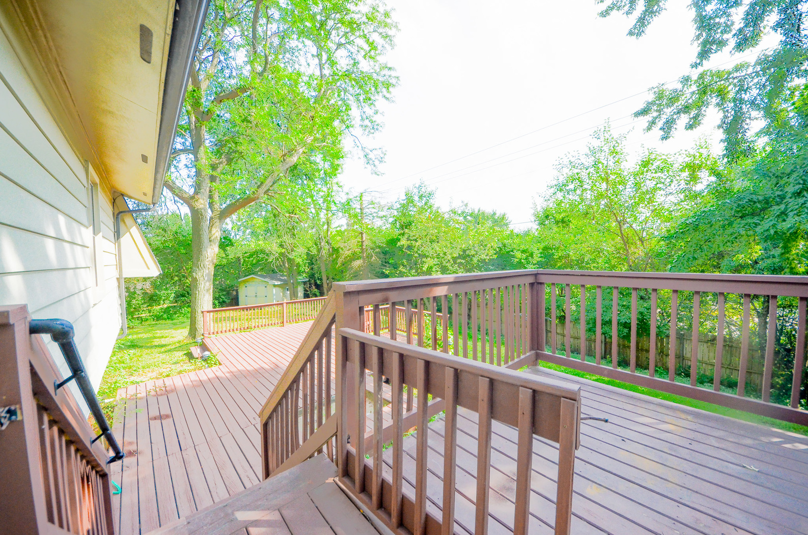 3915 Whispering Trails Drive Hoffman Estates, IL 60192 - Photo 11 of 12 a view of balcony with wooden floor and fence