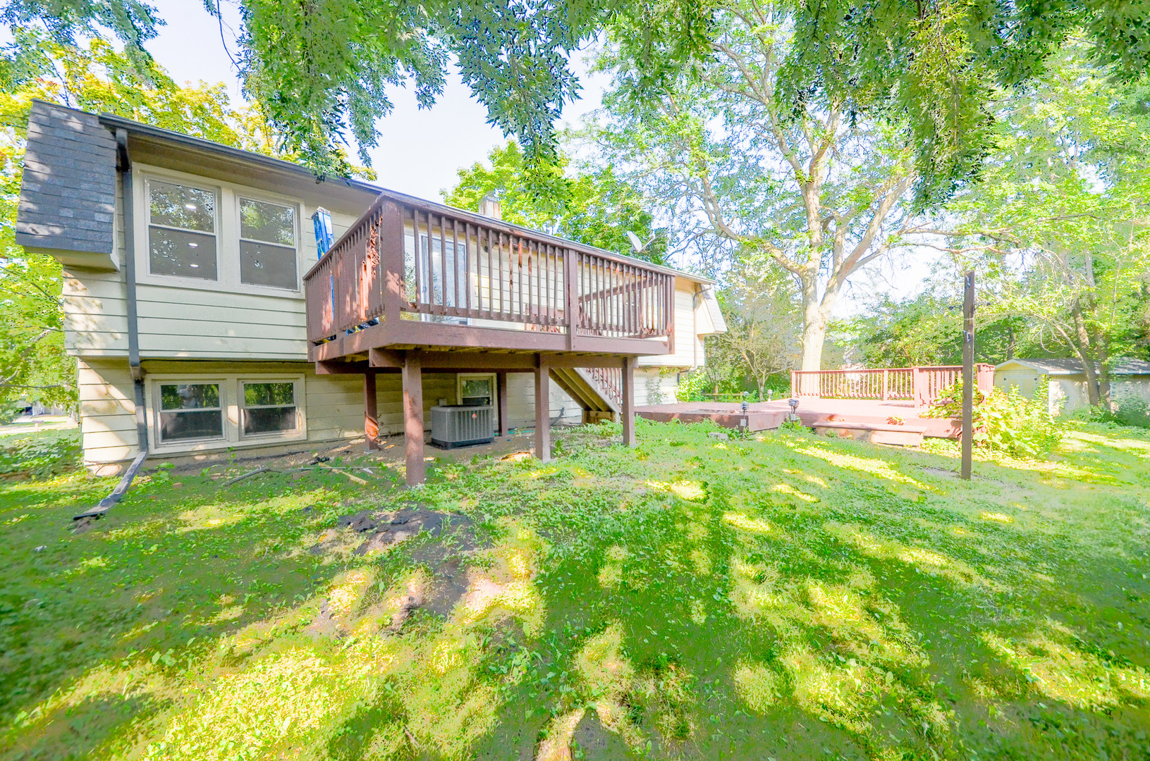 3915 Whispering Trails Drive Hoffman Estates, IL 60192 - Photo 12 of 12 a view of a house with a yard porch and sitting area