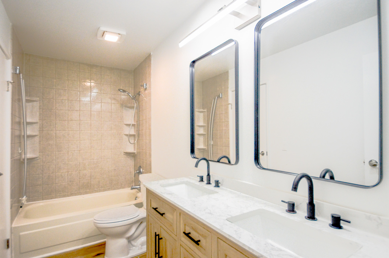 3915 Whispering Trails Drive Hoffman Estates, IL 60192 - Photo 6 of 12 a bathroom with a sink a toilet and shower