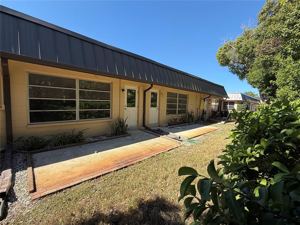 4408 Sunstate Drive New Port Richey, FL 34652 - Photo 17 of 31 a front view of a house with garden
