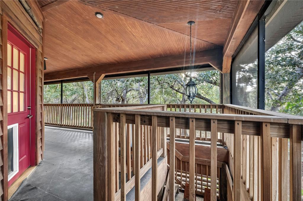 8056 Southwest Horse Creek Road Arcadia, FL 34266 - Photo 12 of 42 a view of a porch with wooden floor and furniture