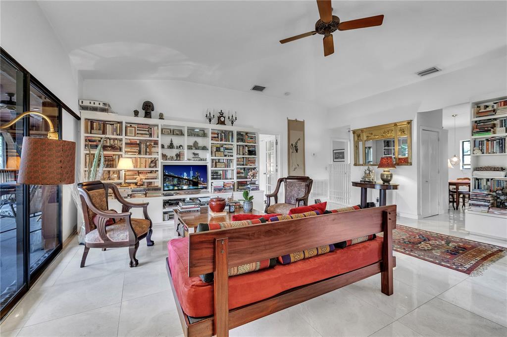 8056 Southwest Horse Creek Road Arcadia, FL 34266 - Photo 13 of 42 a reading room with furniture and a book shelf