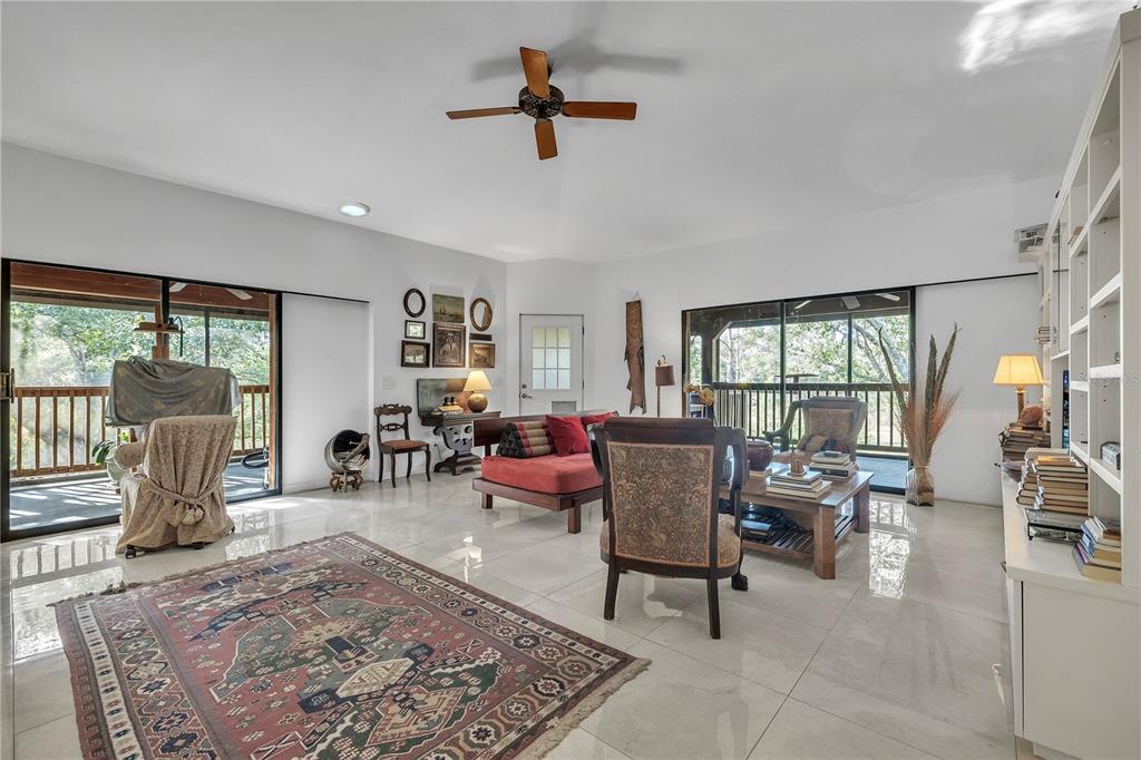 8056 Southwest Horse Creek Road Arcadia, FL 34266 - Photo 16 of 42 a living room with furniture and a large window